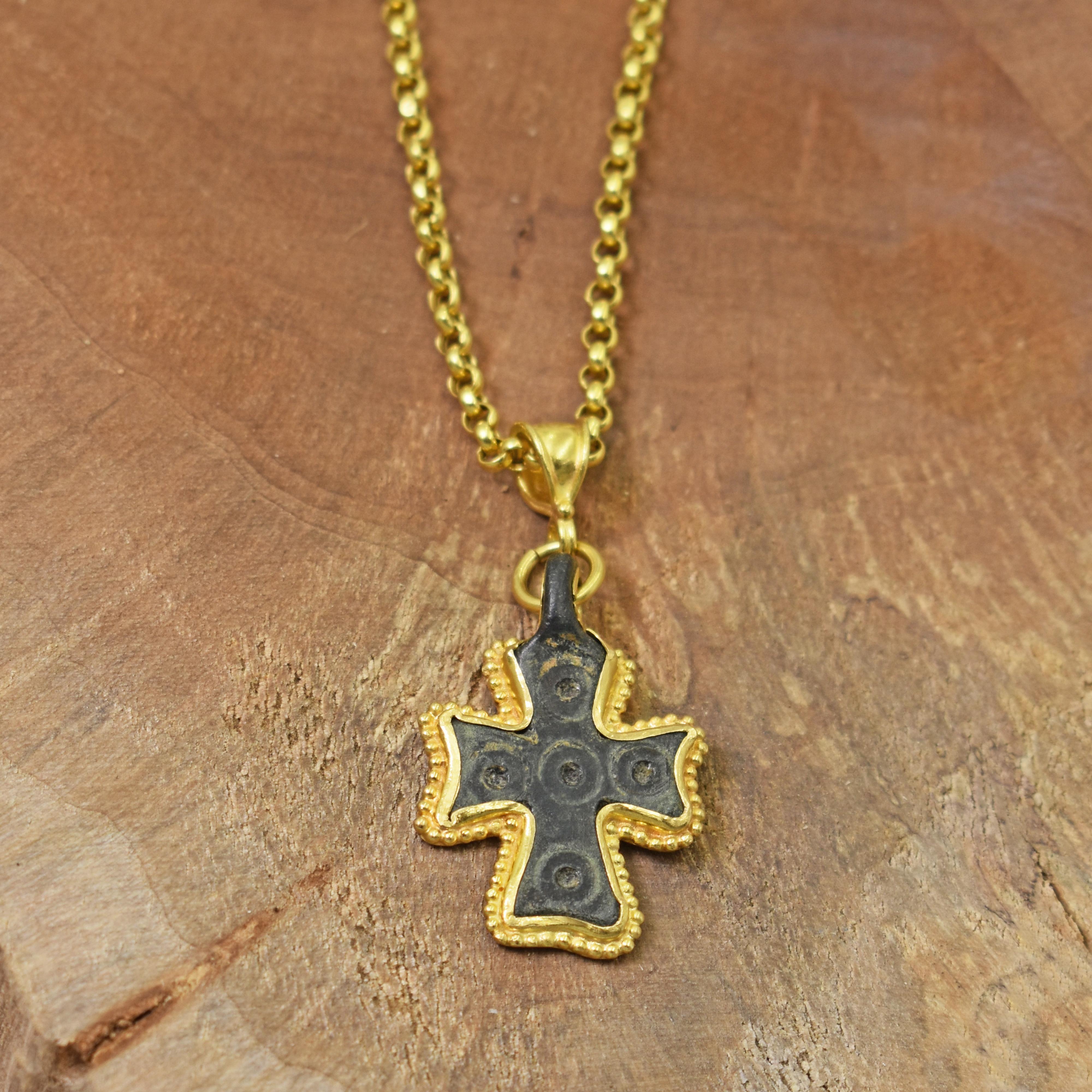 Authentic ancient Byzantine Era Roman bronze cross pendant with contemporary added 22k yellow gold bezel and bail. Chain not included.