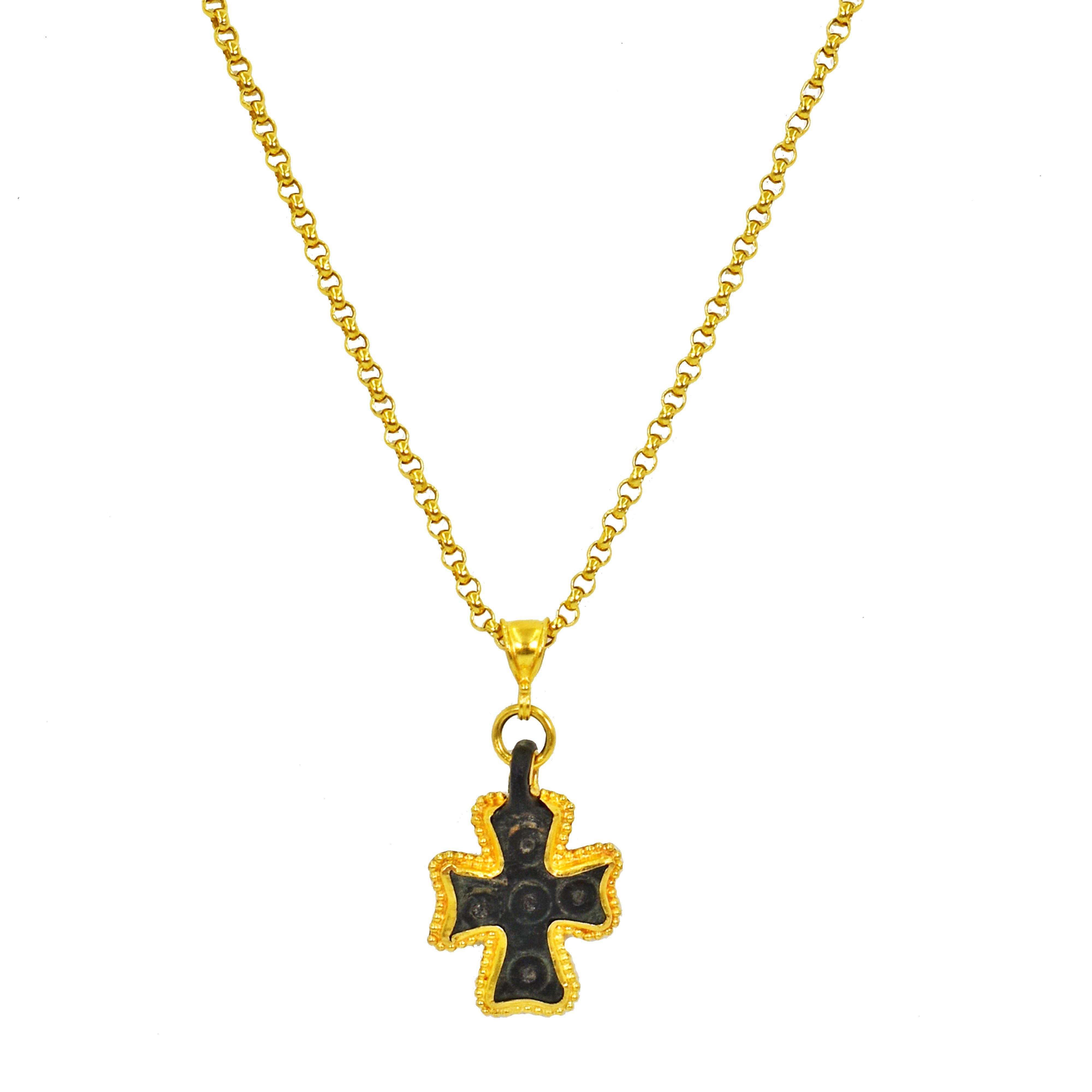 Authentic ancient Byzantine Era Roman bronze cross pendant with contemporary added 22k yellow gold details on an 18 inch 21k gold Rolo chain necklace. Pendant, including bail, is 1.44 inch in length. Bronze cross is in good, ancient condition with