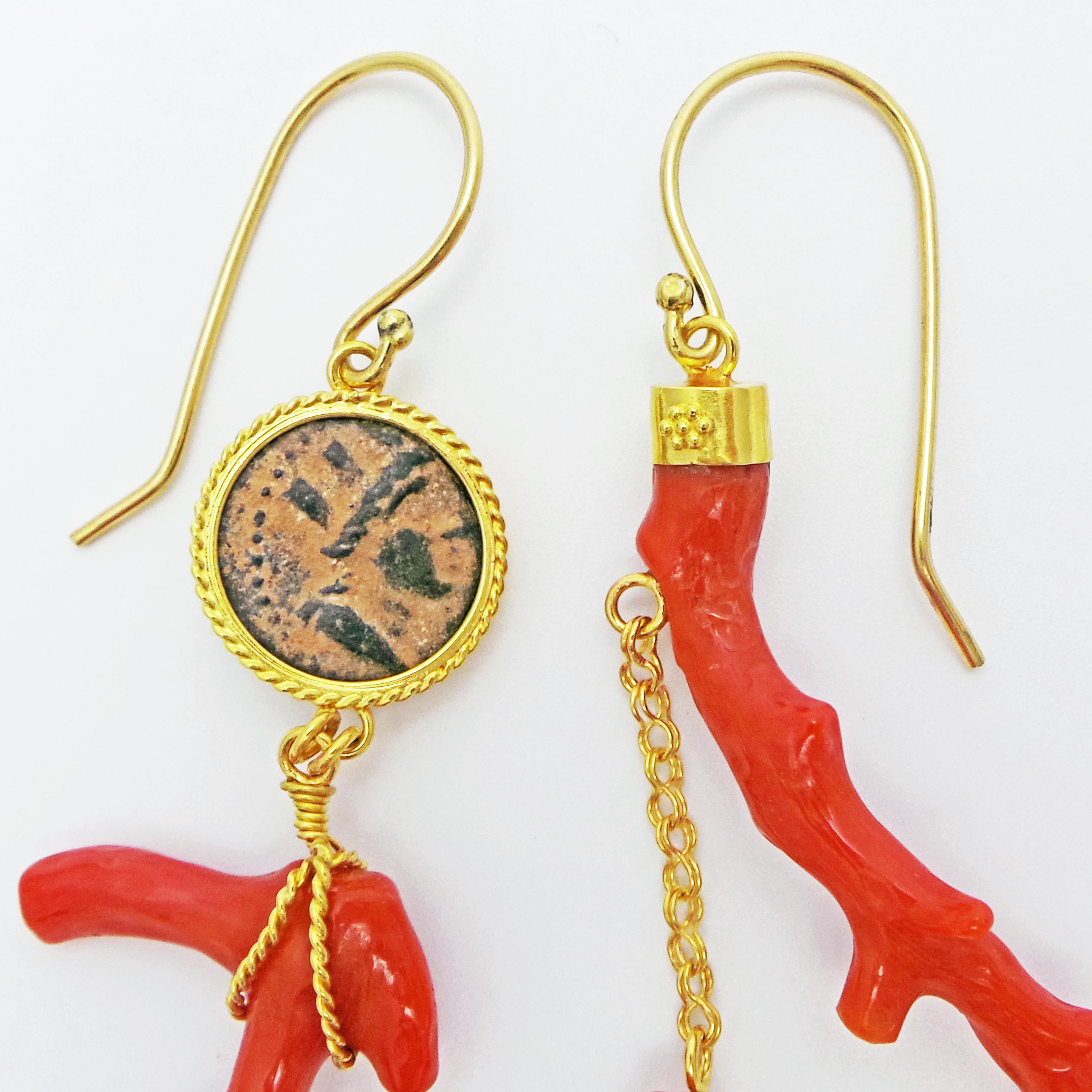 Authentic ancient bronze Hellenistic coin (Phoenician, 2nd century BC) and organic branch coral set in 22k yellow gold one-of-a-kind, asymmetrical dangle earrings. These exquisite and unique statement earrings blend an old world artifact and coastal