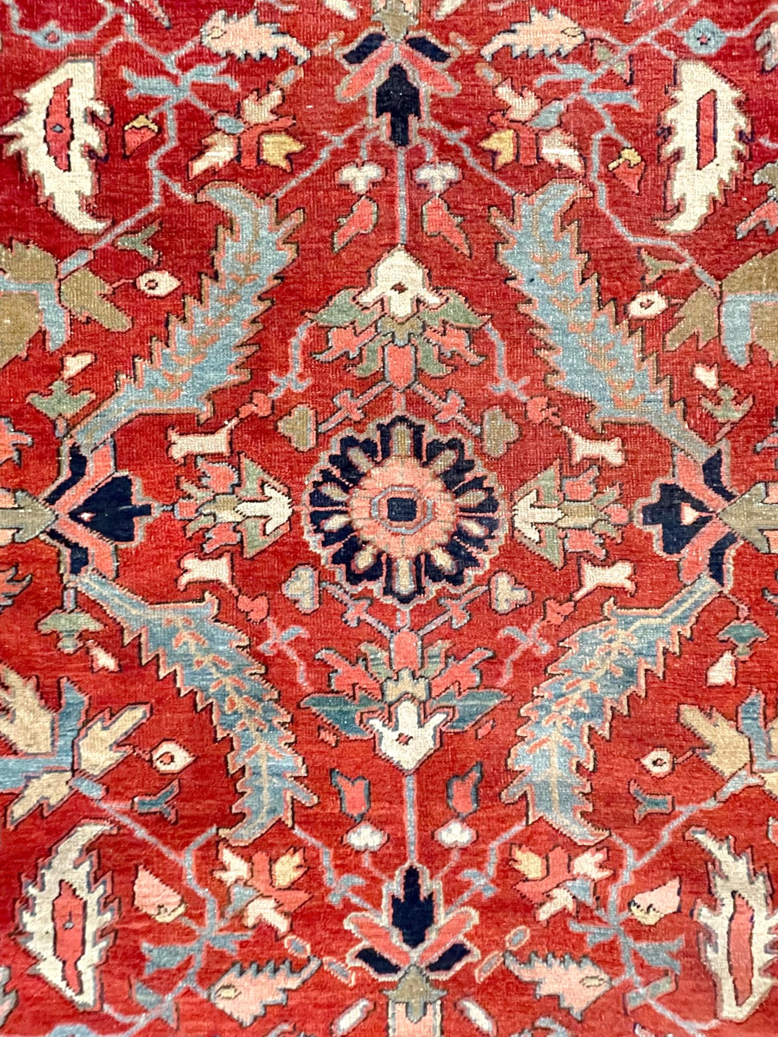 This Persian Tabriz-Heriz rug, Heriz rugs are Persian rugs from the area of Heriz, East Azerbaijan in northwest Iran, northeast of Tabriz. This rug has wool pile and cotton foundation, hand knotted with an excellent condition for its age. This rug