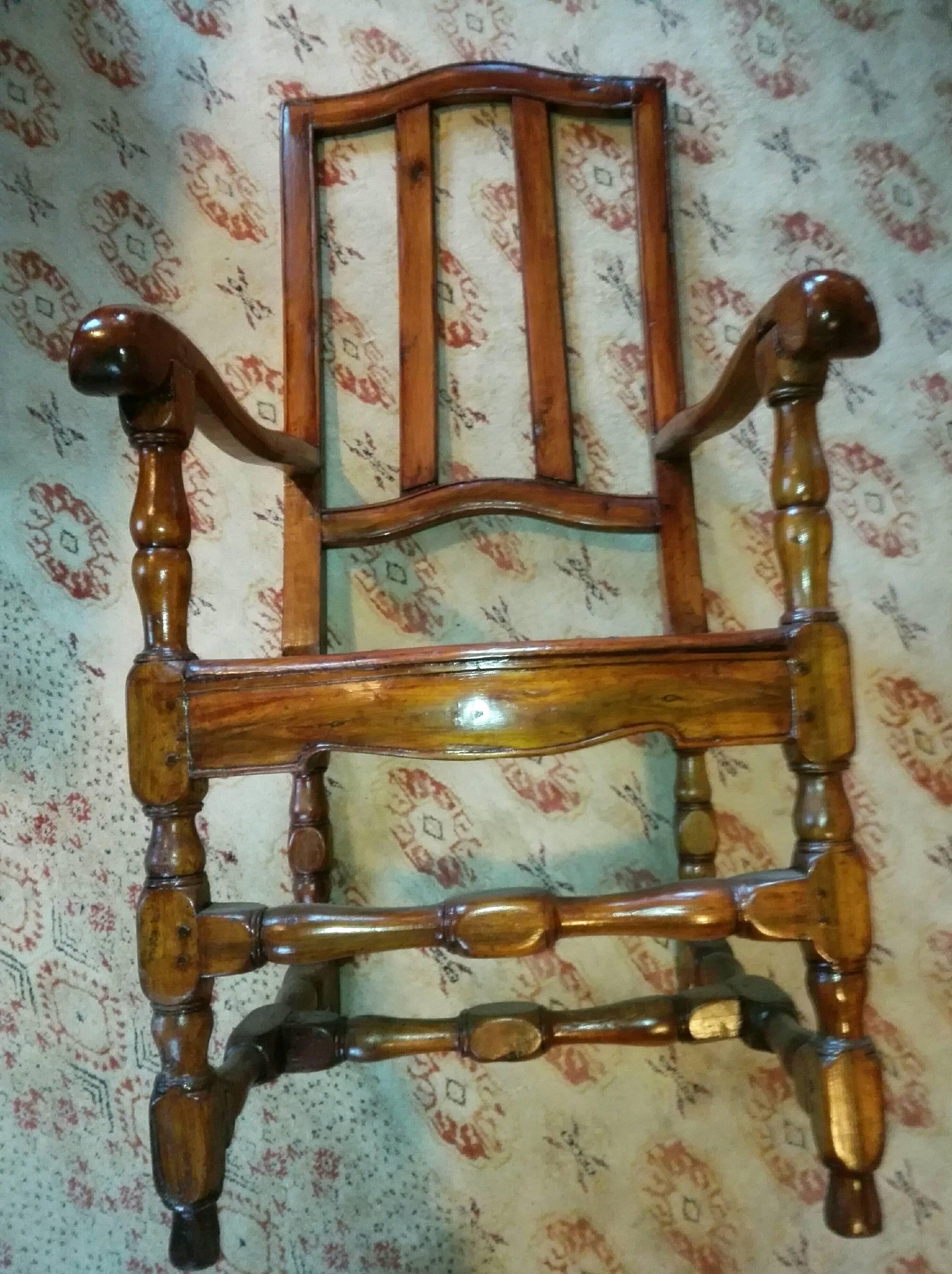 This wonderful, original and authentic, dappled and dowelled, as well as plastically carved and hand polished armchair in walnut , is still from the inventory and my father's collection . All components are original and belongin ! In it's many