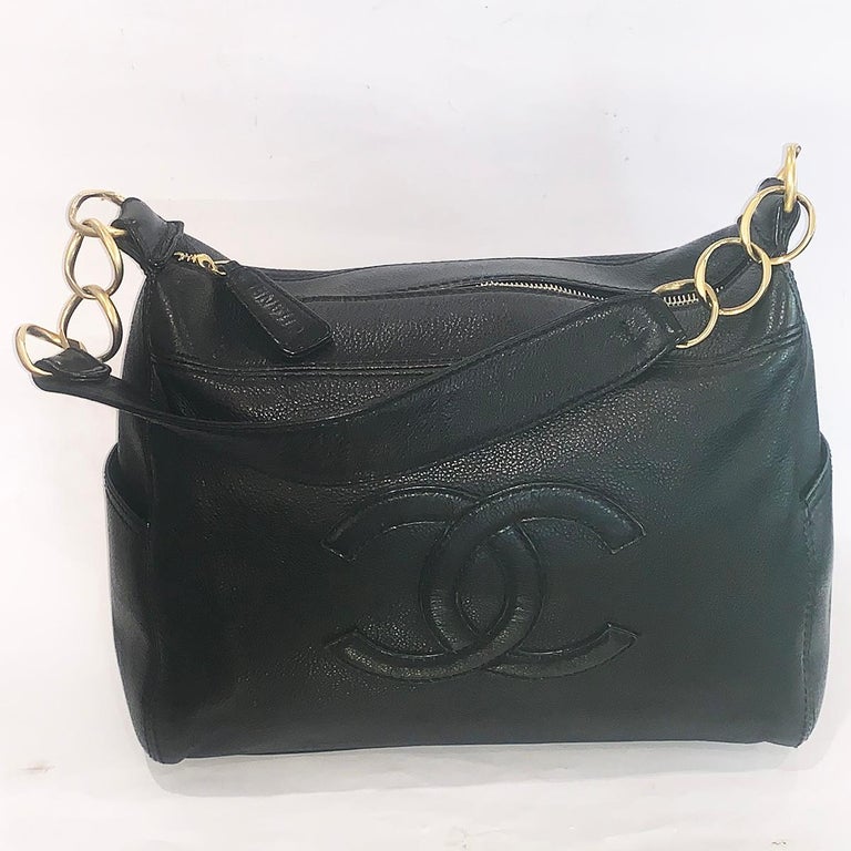 A Chanel Oyster Leather in Caviar finish, Black Handbag with Gilt trim and the large “CC” to the front. All in excellent, near new condition. The bag has an outer pocket to each end; the interior has the usual gilt on leather Badge with “CHANEL, R”