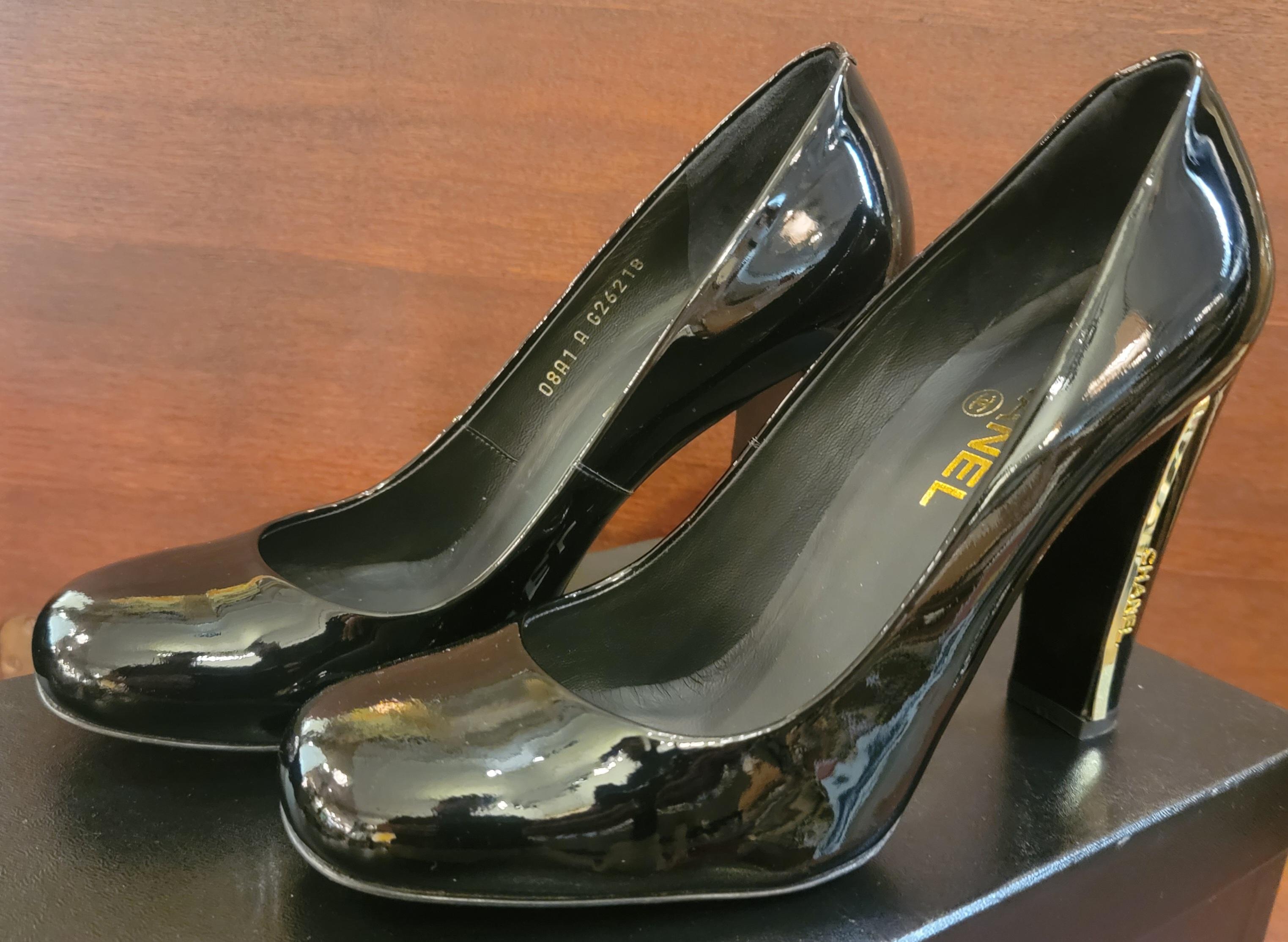 Rare Authentic Brand New never used Chanel Leather Size 39.5 High Heel Shoes with Chanel Gold Accent. the heels have metal Gold accents of Chanel Written out. Beautiful design, sleek and sexy. 