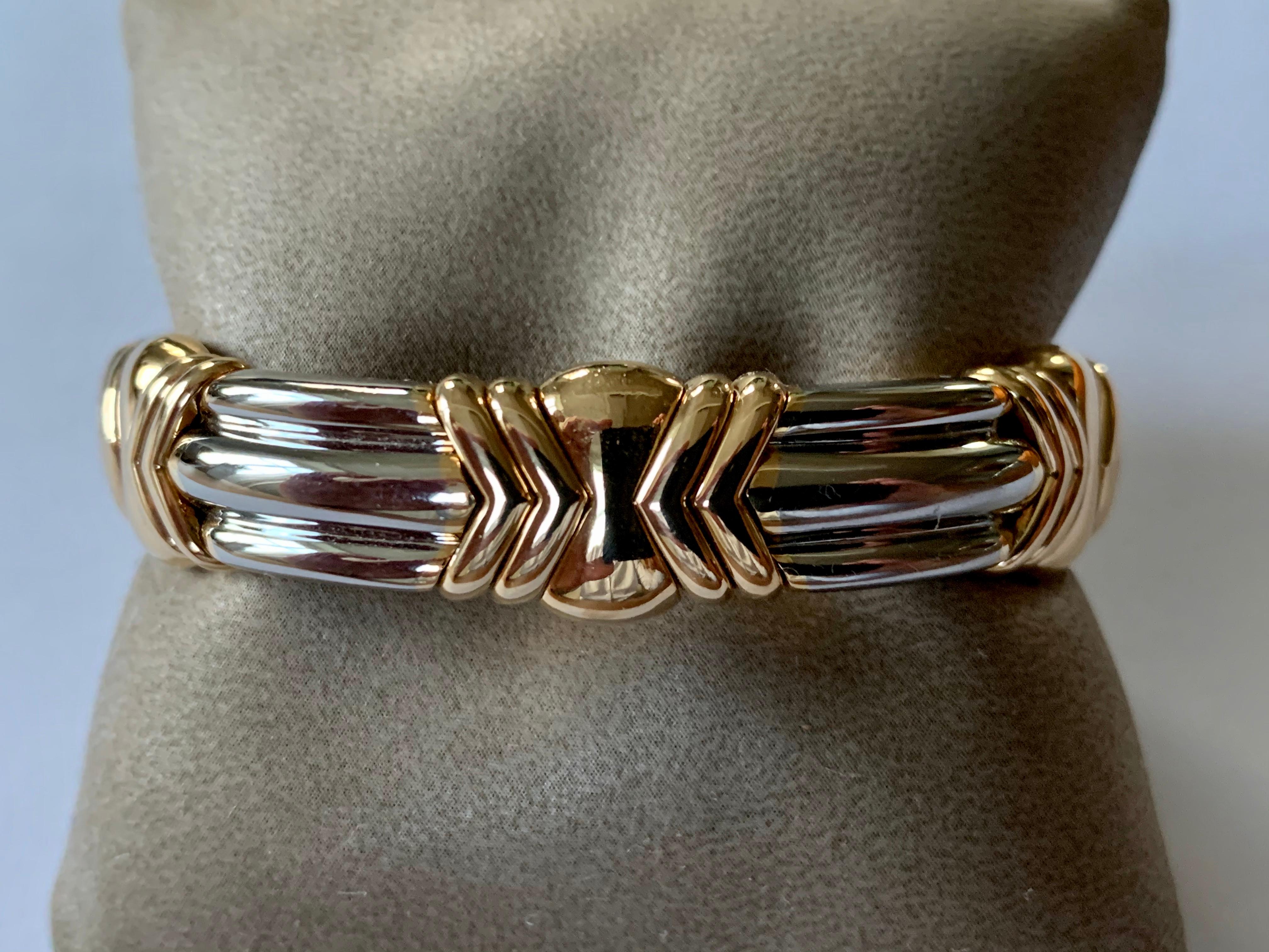 A unique stainless steel and 18k yellow gold Bvlgari bangle. The bangle features a flexible design allowing to a wrist size of up to 19 cm. The bangle measures 13 mm in width and has a gross weight of 64.8 grams.