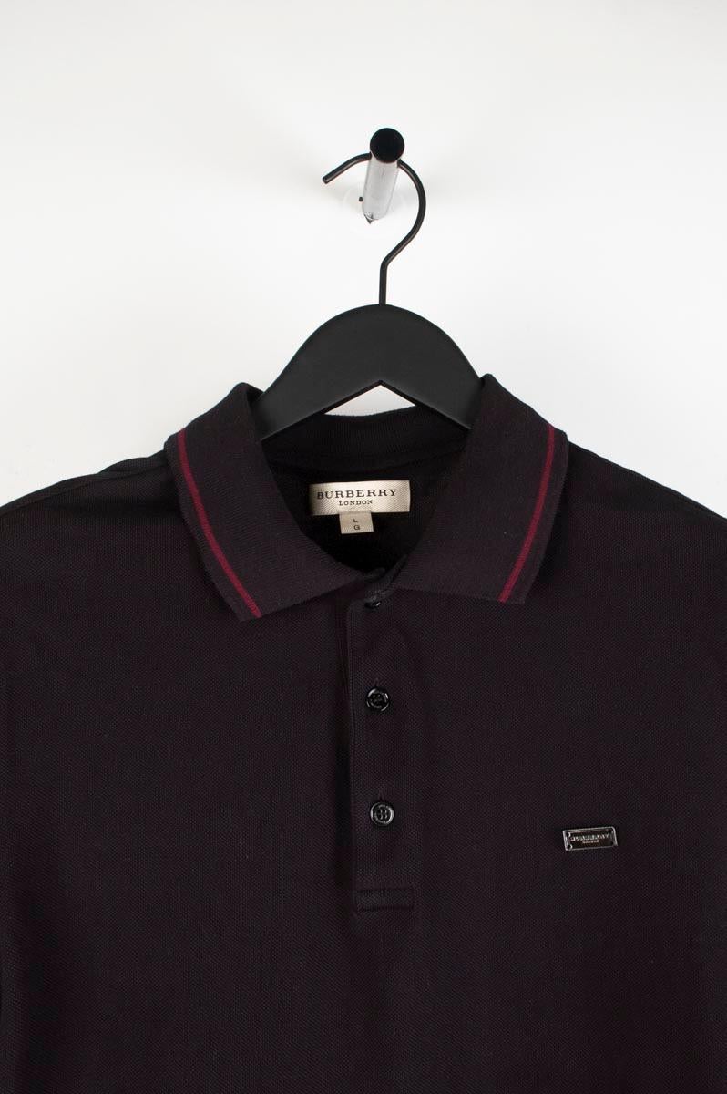 Item for sale is 100% genuine Burberry Polo Men Shirt, S195
Color: Black
(An actual color may a bit vary due to individual computer screen interpretation)
Material: 100% cotton
Tag size: L 
This shirt is great quality item. Rate 9 of 10,
