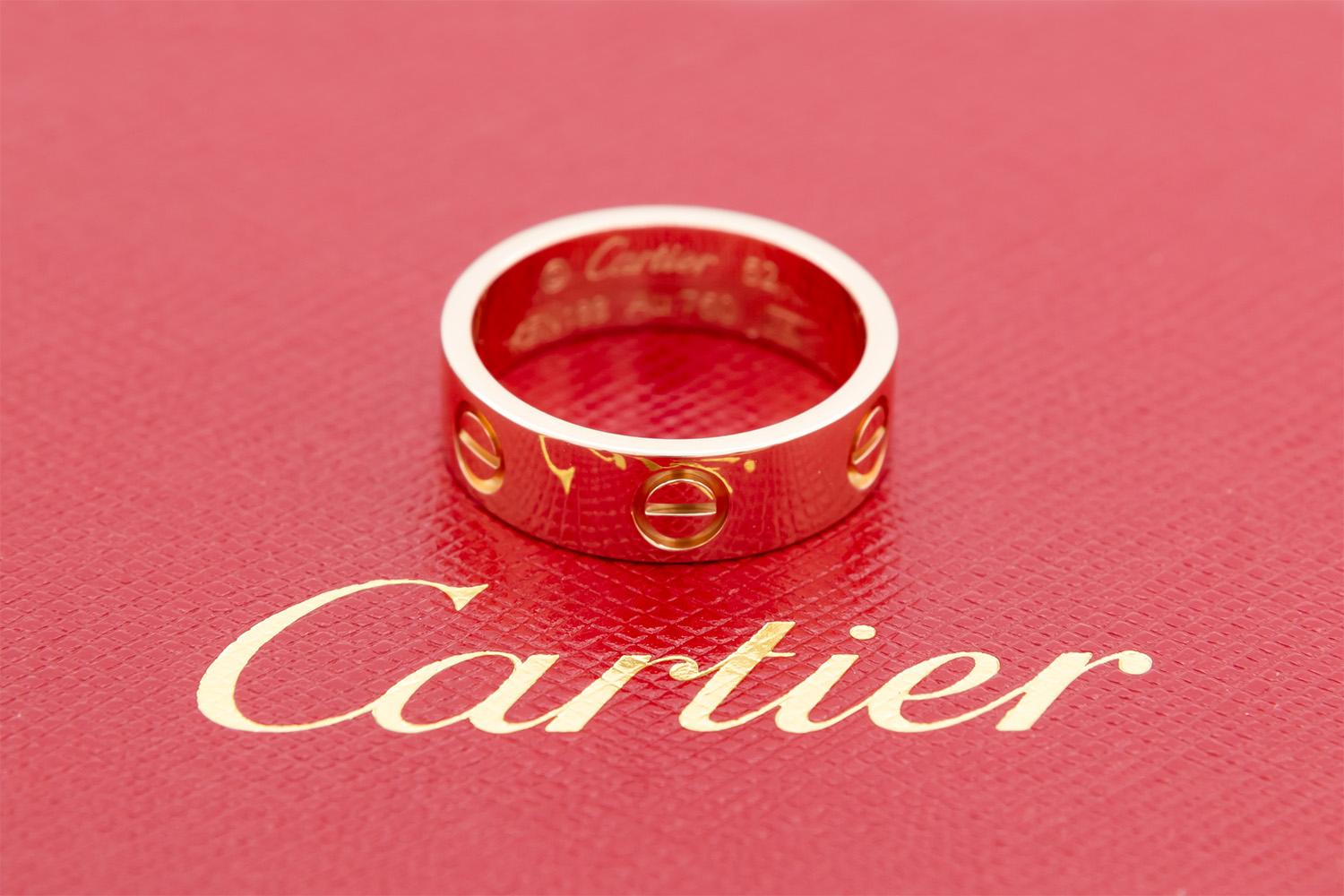 We are pleased to offer this Authentic Cartier 18K Rose Gold Love Ring. This is the 5.5mm love ring in a size 52 EU/6.25 US. It comes complete with the Original Cartier ring box, Cartier service/travel pouch and original Cartier receipt. The ring is