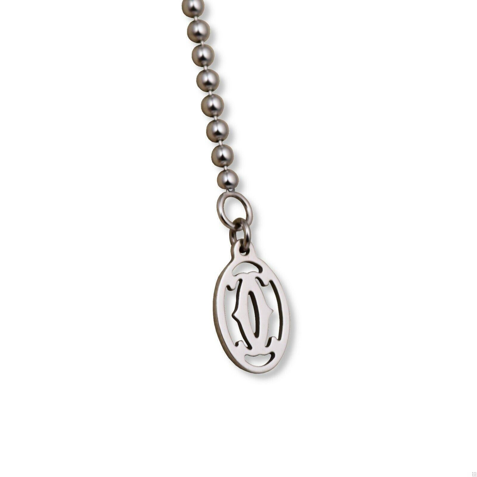 This ball chain necklace from Cartier is light as a feather and sits comfortably on the neck. Made of 18k white gold, it exudes mysteriousness and elegance. Almost invisible, it catches the light beautifully. Whether worn over a shirt or peeking out