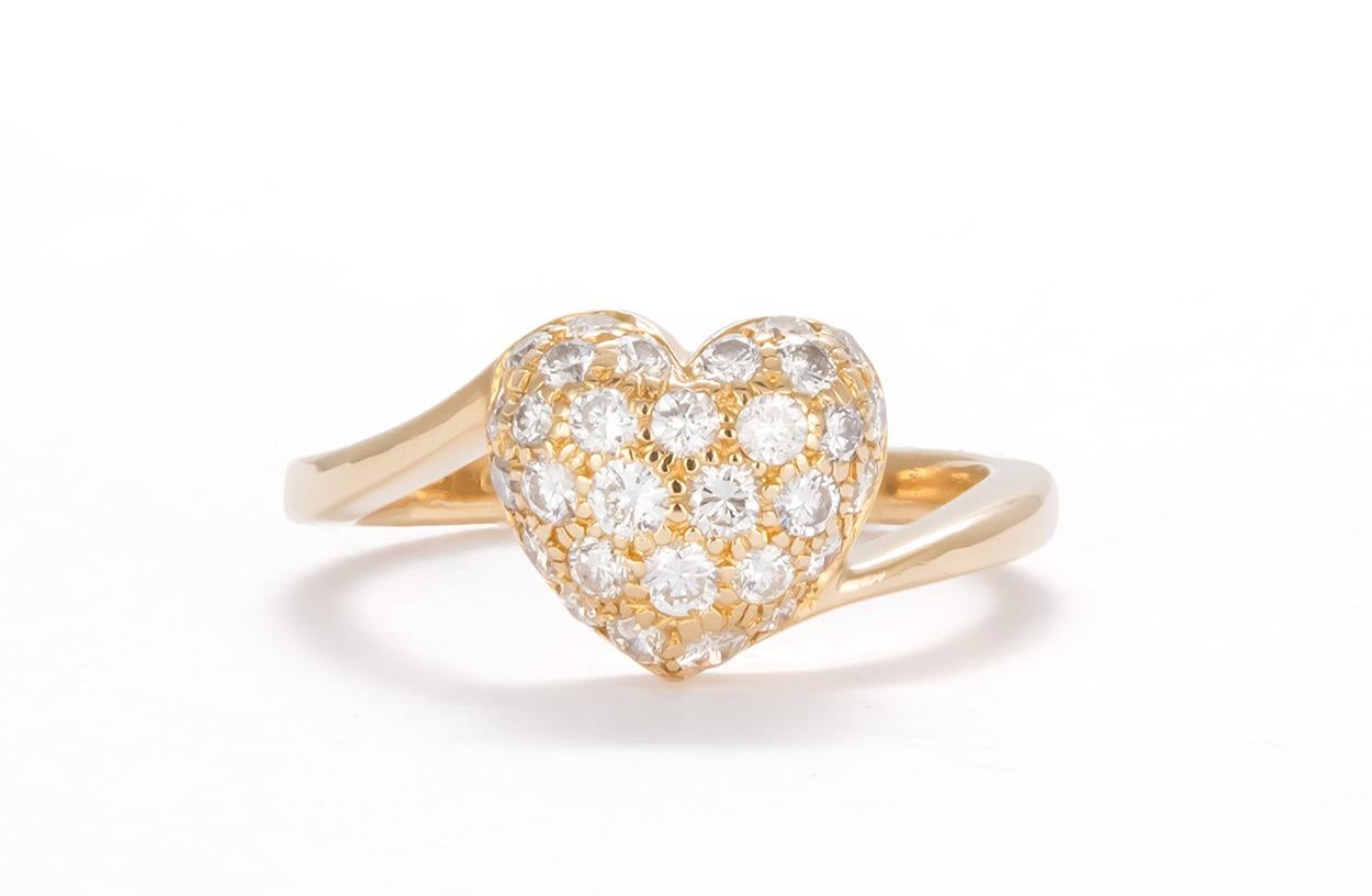 We are pleased to offer this Authentic Cartier 18K Yellow Gold Diamond Pave Heart Ring. Elite elegance from house of Cartier, this gorgeous ring is crafted from solid 18k yellow gold with a fine polished finish and boast a lovely diamond pave heart