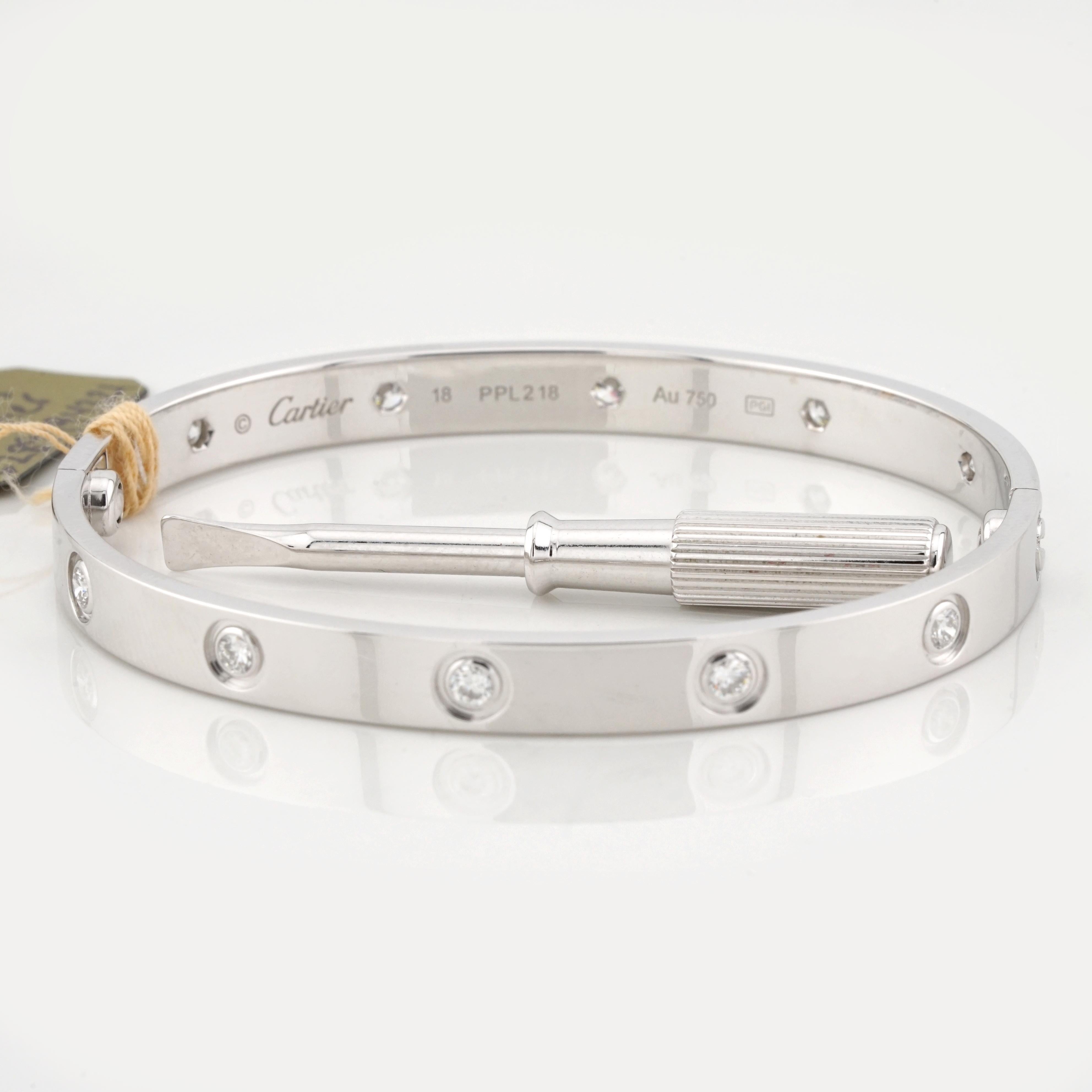 This iconic Cartier Love Bracelet is crafted from luxurious 18K white gold and features a full set of natural round brilliant-cut diamonds totaling approximately 0.96 carats. The bracelet embodies the timeless elegance and craftsmanship synonymous