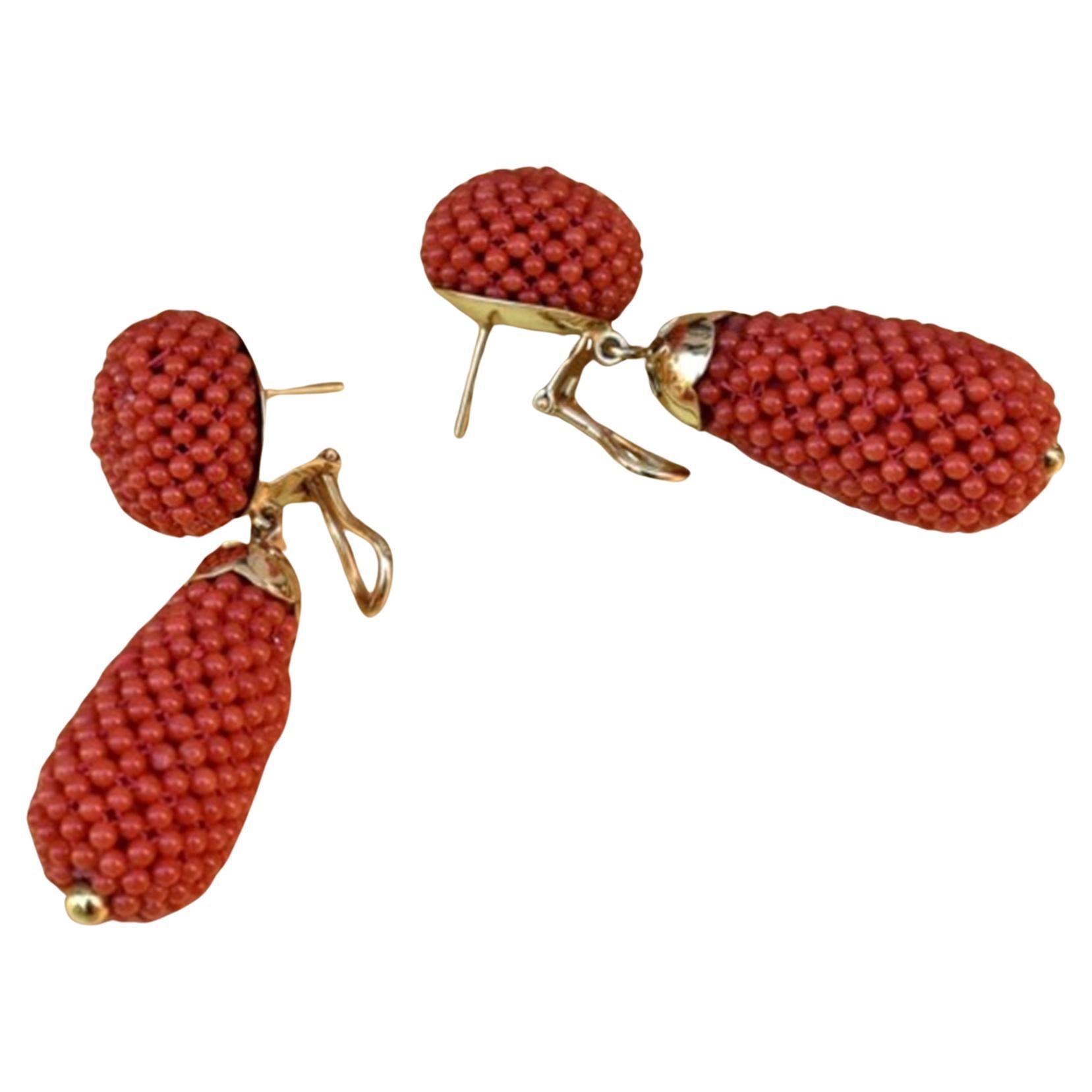 Fabulous pendant earrings in 18 kt gold and Sardinian coral balls woven into fabric. The top is a coral button and supports the large pendant coral drop. Woven workmanship is a rare workmanship. Unique, vintage piece, dating back to the 1980s.


