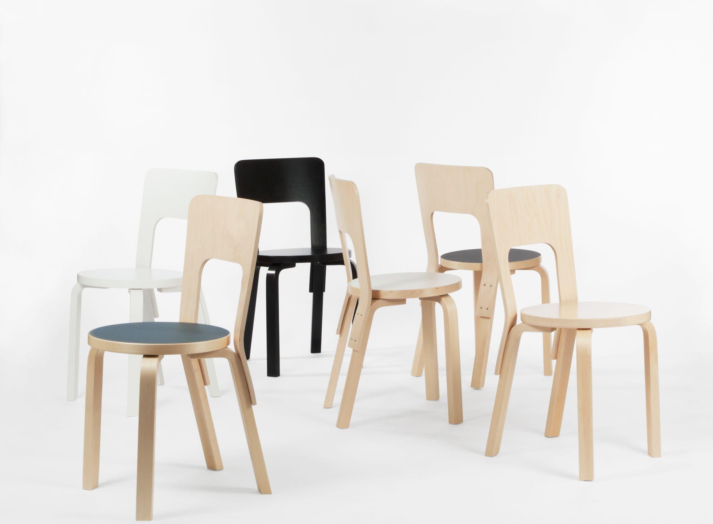 Authentic chair 66 in lacquered birch with linoleum seat by Alvar Aalto & Artek. Chair 66 is a universal wooden chair in the tradition of classic kitchen and café chairs; it's visible, additive construction logic is full of character and pleasing to