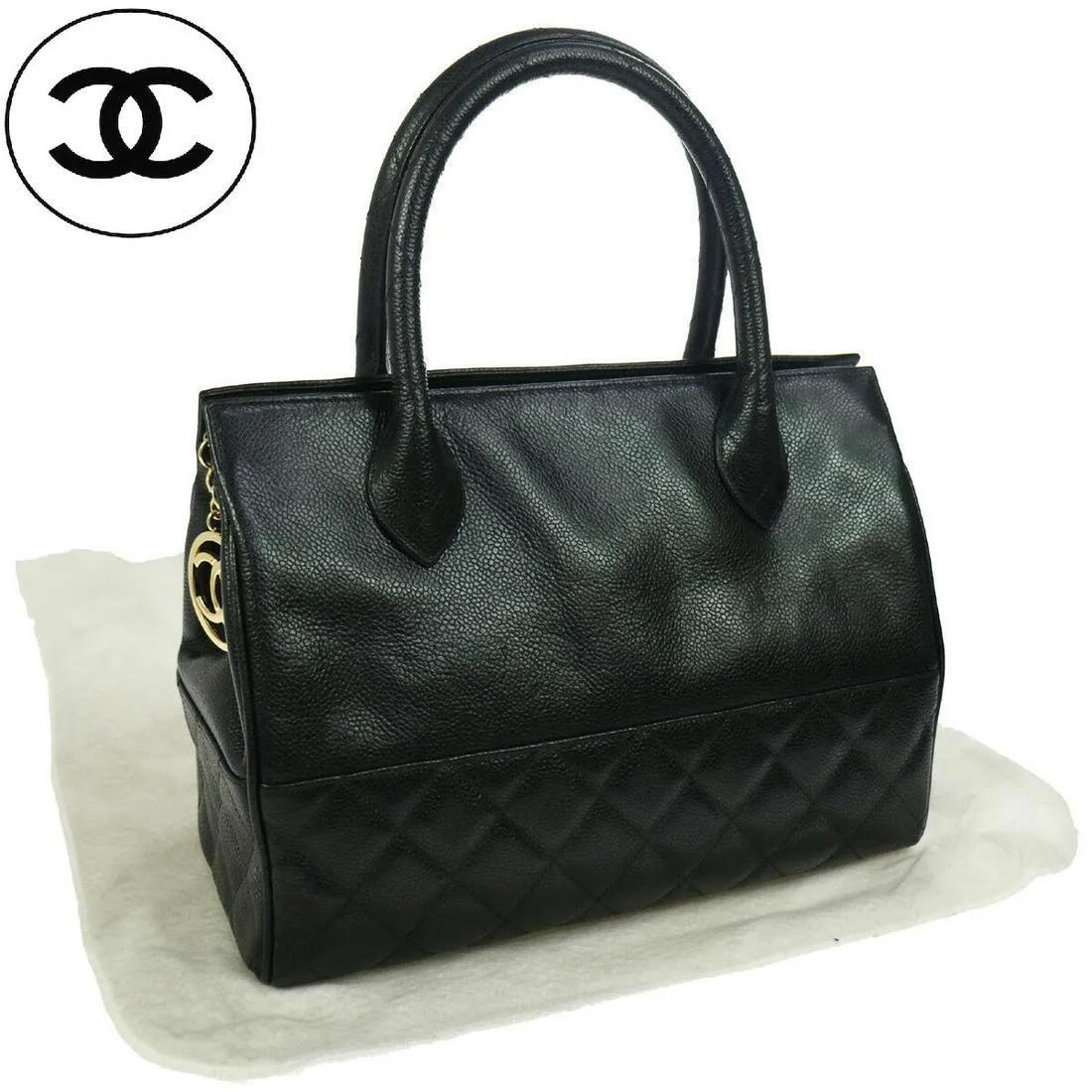 Authentic Chanel Runway Black Caviar Doctors Handbag Gold Accent.

Italian Caviar leather Doctors hand bag with Chanel CC Gold accents. Zipper enclosure and buckle provide a clean aesthetic to this beautifully caviar leather bag. The top straps are