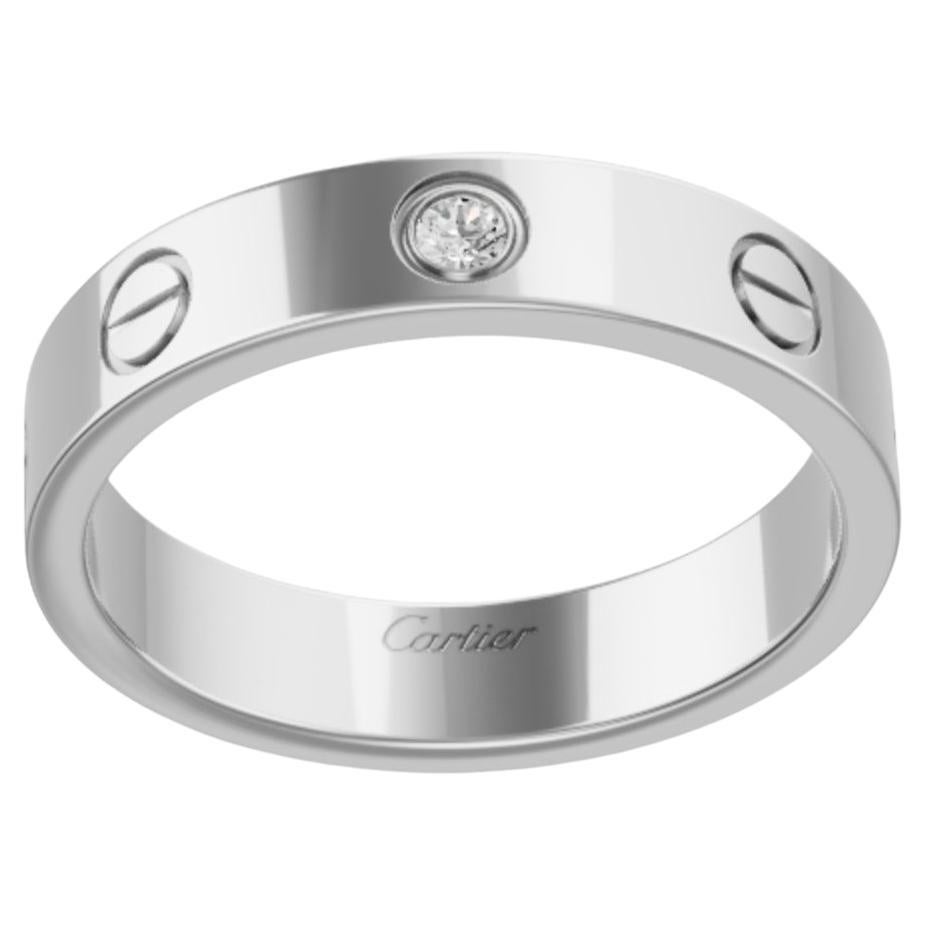 Authentic Cartier Love One Diamond Ring
Engraved Cartier   750   46  CO6492 *ITO
0ne round diamonds
This gorgeous ring has been reviewed for authenticity, professionally polished , Overall, excellent condition!
Size of the ring can be changed a
