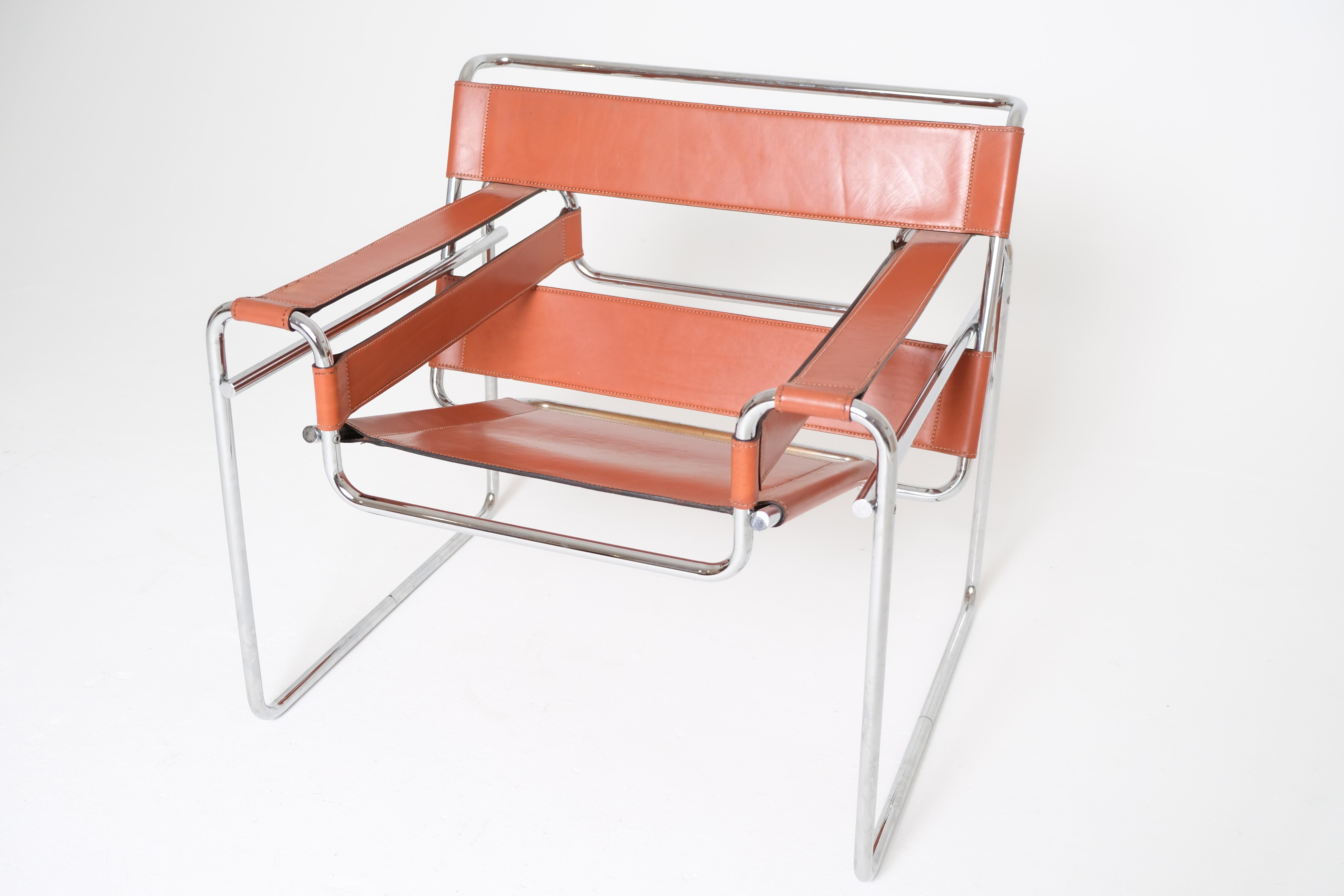 An iconic Bauhaus design, this authentic Wassily chair by Marcel Breuer was produced by Gavina in Italy prior to its acquisition by Knoll. It features its original tubular chrome-plated steel frame with welded end caps—an important hallmark of early
