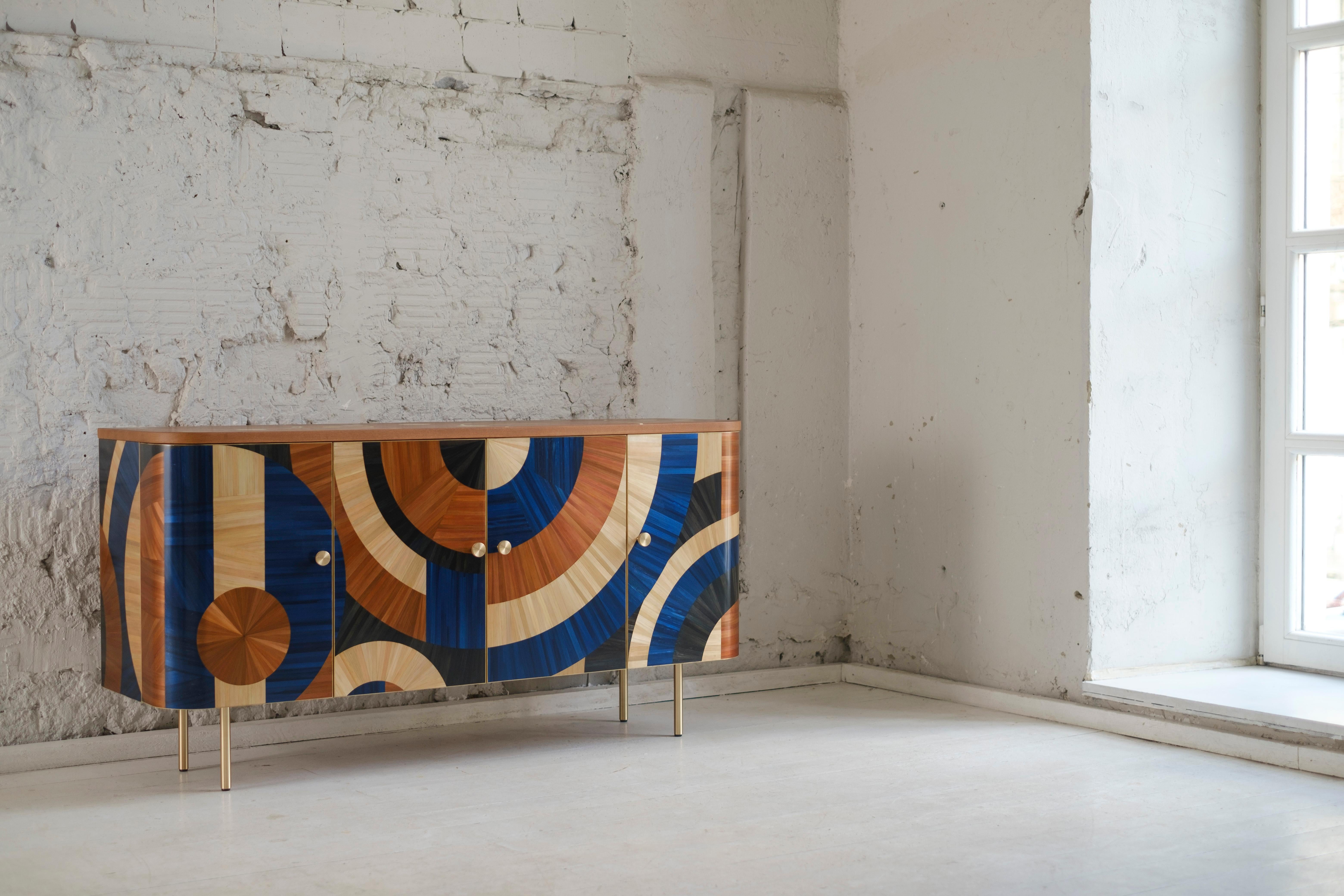 The cabinet Solomia is inspired by the fertility of our land. We present it in the new colors. The ornament of this version is made in blue, black, terracotta, and natural straw.
Seemingly trapped between past and future, the cabinet became an