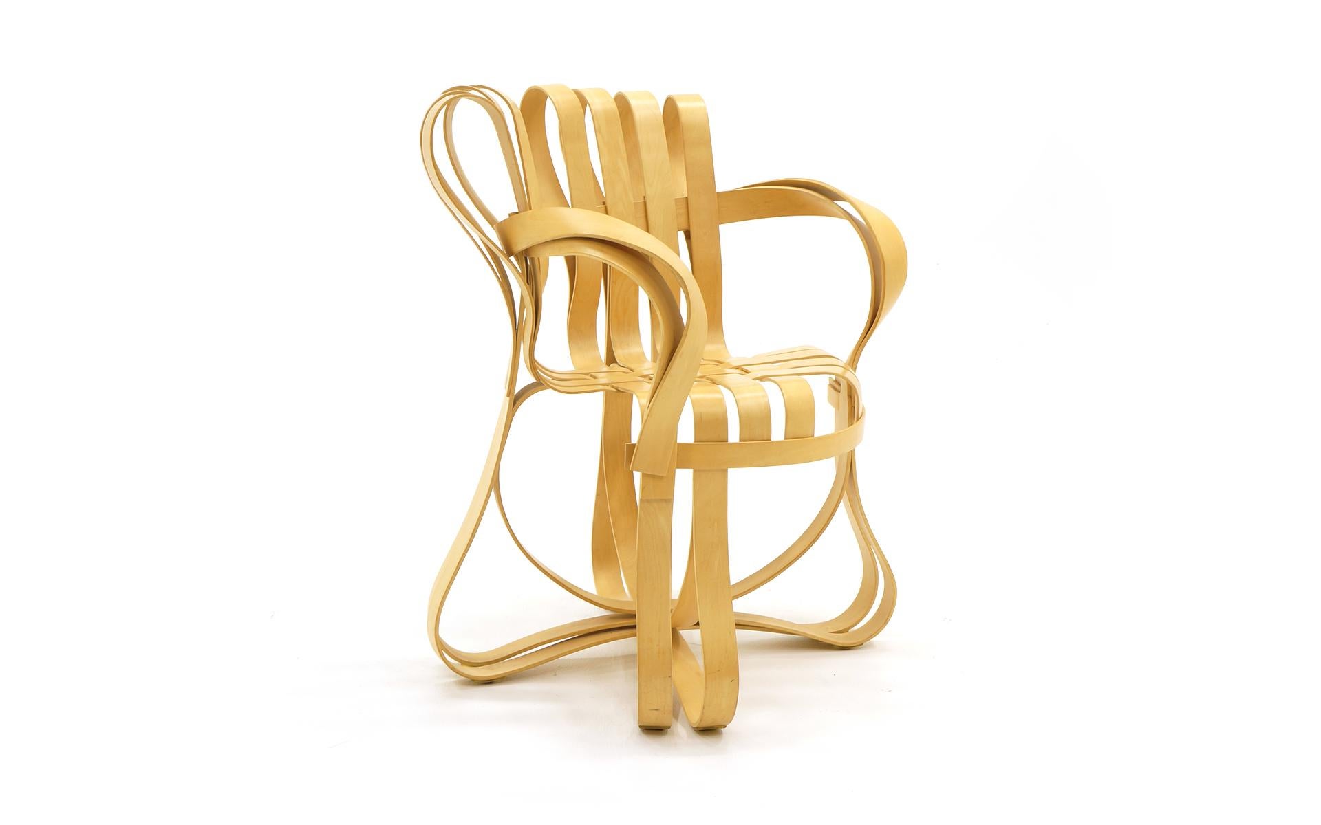 Frank Gehry cross check chair with arms manufactured by Knoll. A stunning piece of functional art made of interwoven maple strips. Signed with branded signature of Frank Gehry and Knoll.
