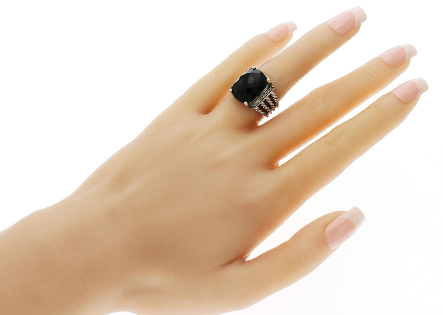 100% Authentic, 100% Customer Satisfaction
Top: 16 mm
Band Width: 5.5 mm
Metal: 925 Sterling Silver 
Size: 5
Hallmarks: DY 925
Total Weight: 9.8 Grams
Stone:  0.13 CT Diamonds  Color: L - M  Clarity: SI - I  and Black Onyx 
Condition: Pre