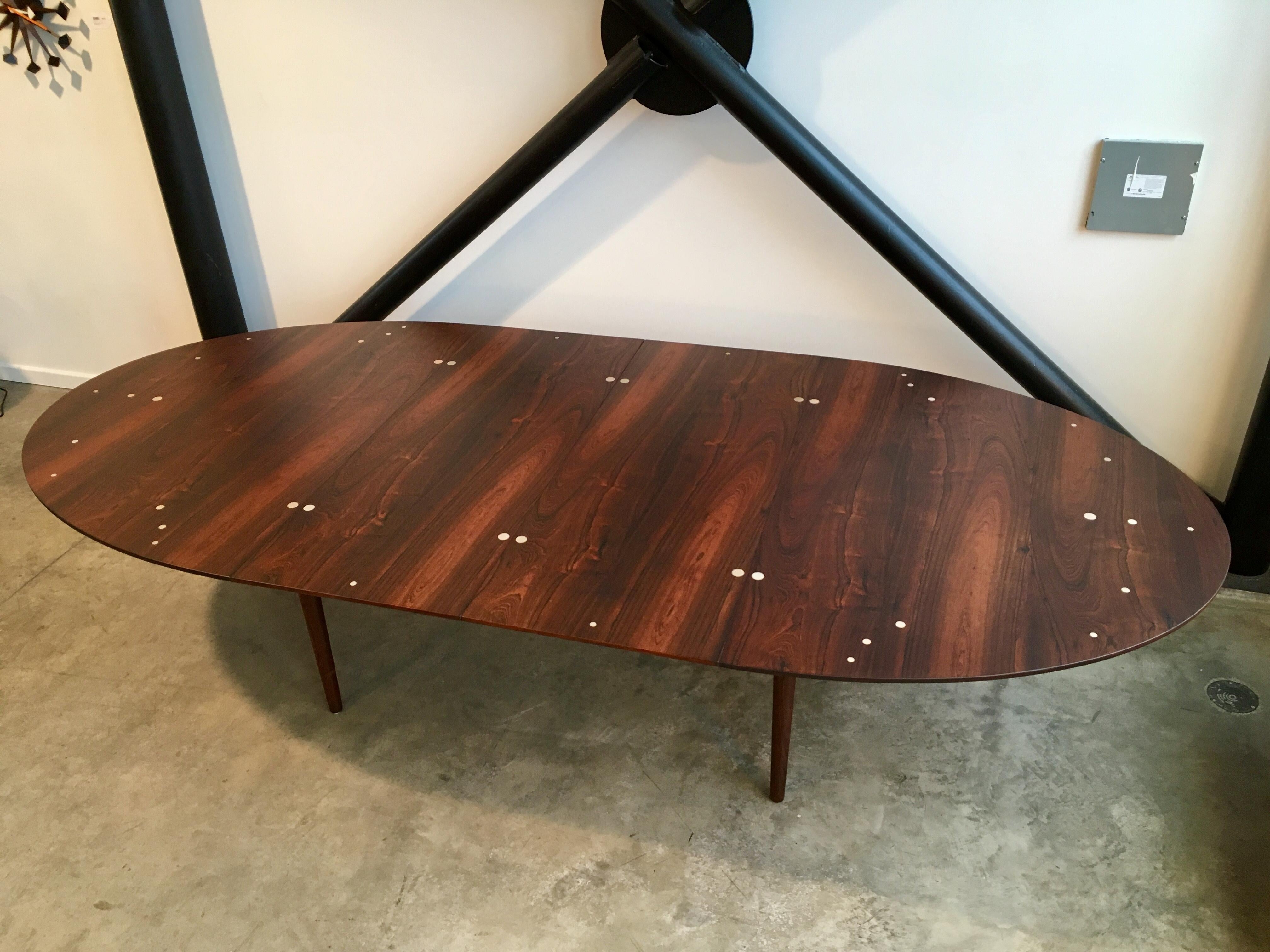 Authentic Judas table by Finn Juhl for Niels Vodder. This is the larger version in highly figured rosewood with silver plaquettes. 

Excellent condition. 
 