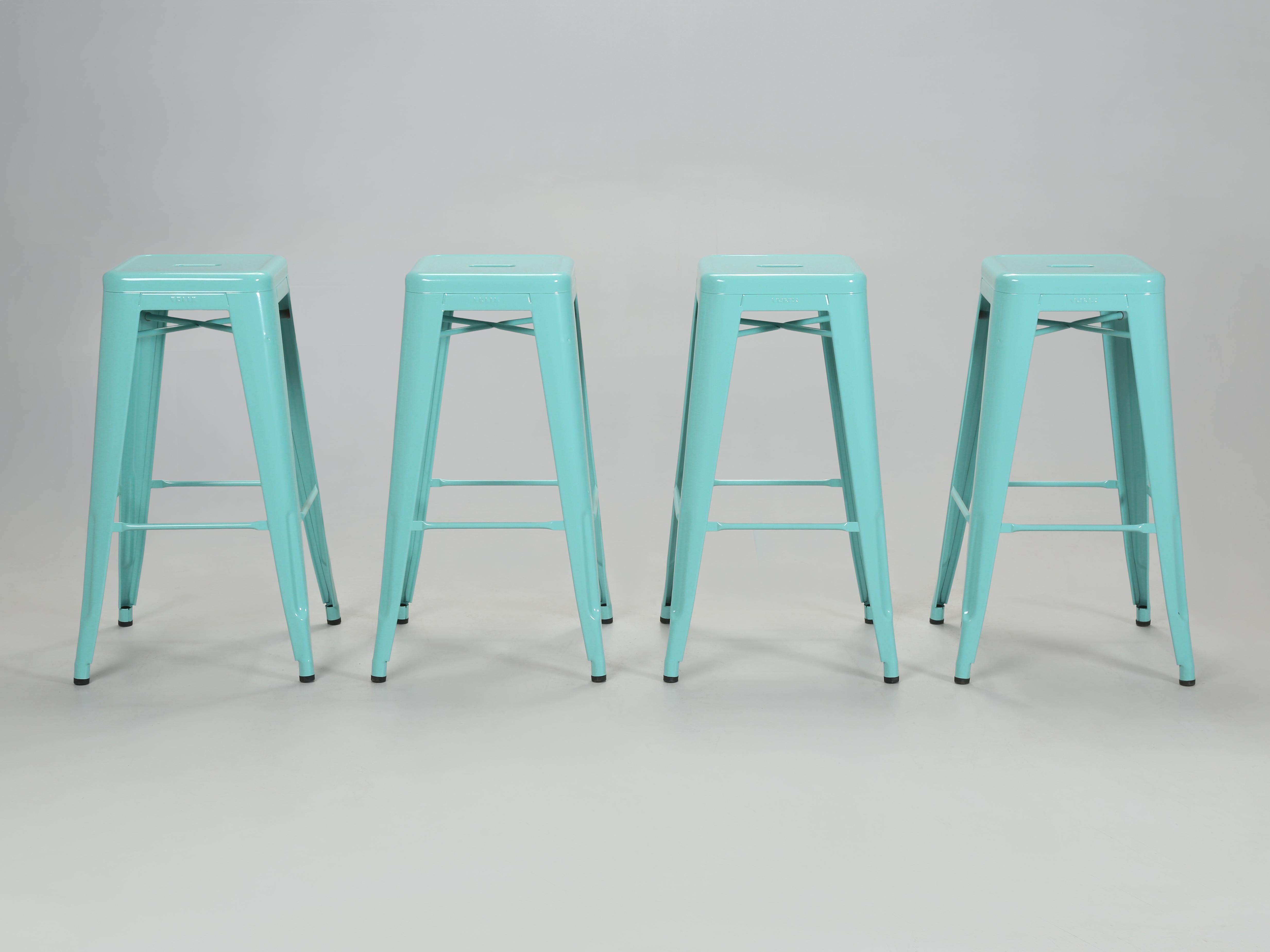 Authentic Tolix Set of (4) Light Green (we think more or an Aqua is appropriate) Powder-Coated Steel Stacking H75 Bar Height Stools. Tolix Color spec is, RAL 6027. The seat height is 29.5