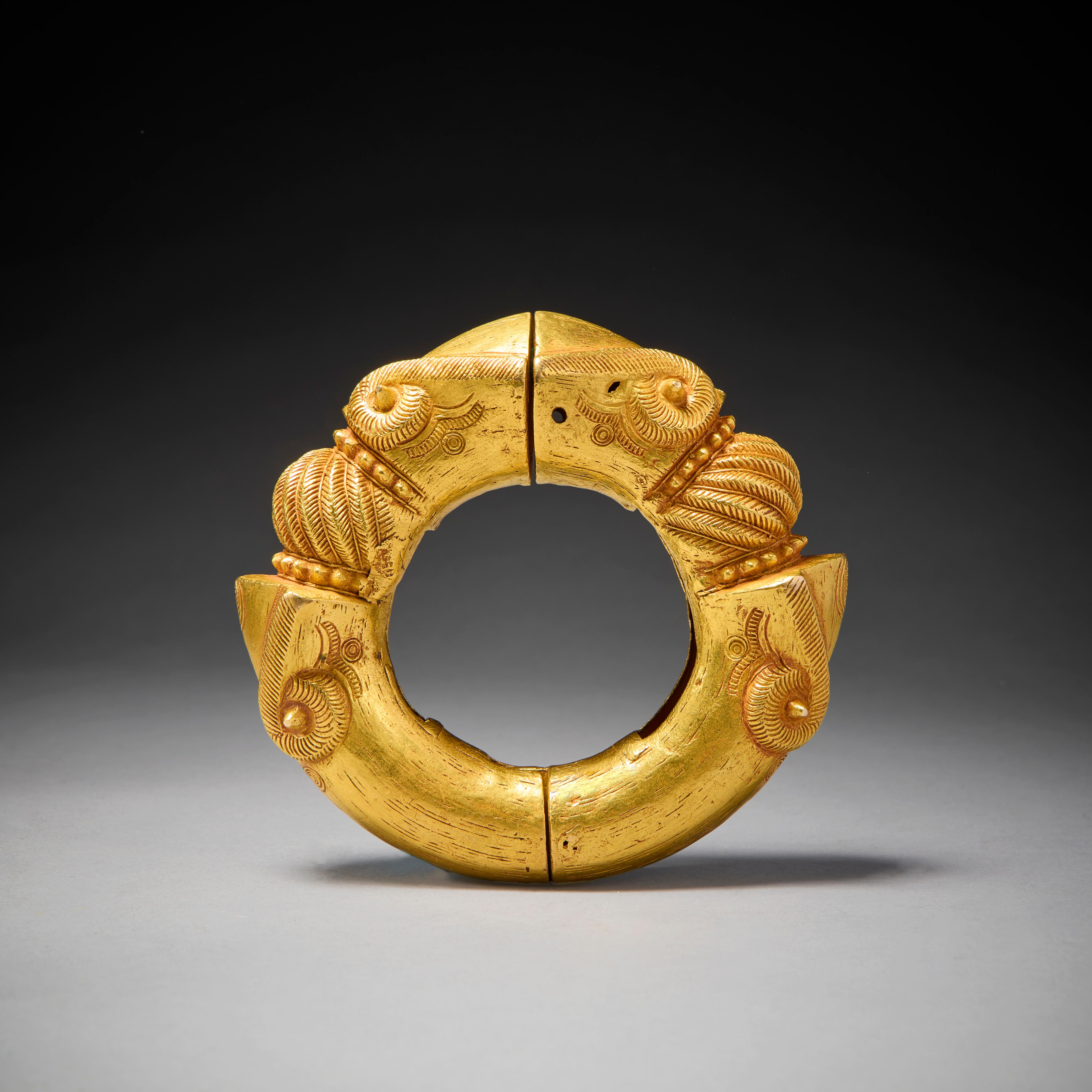 This magnificent gold bracelet was made for Ashanti royalty. 

The Ashanti Kingdom's wealth was significantly based on gold-mining and trading in gold, as well as agriculture. The kingdom continued to expand until under Asantehene Osei Bonsu