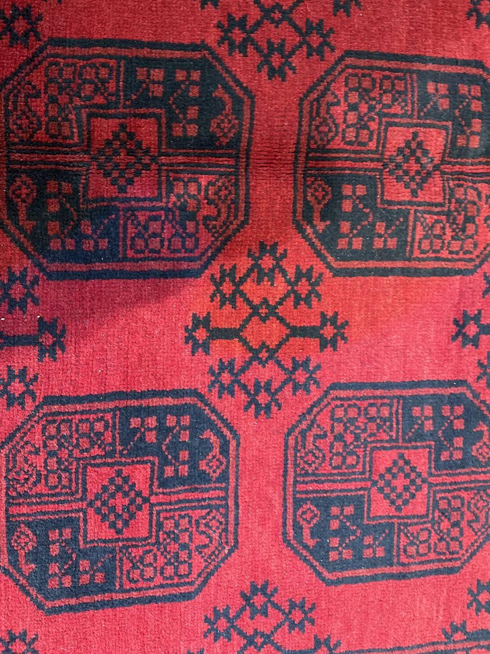Fine quality handmade Afghan Red rug featuring Gul motifs and framed by richly ornamented borders.
This Turkman Rug is created using the art of knotting from the Ersari from the past century. The Ersari, Turkmen nomads from the north of