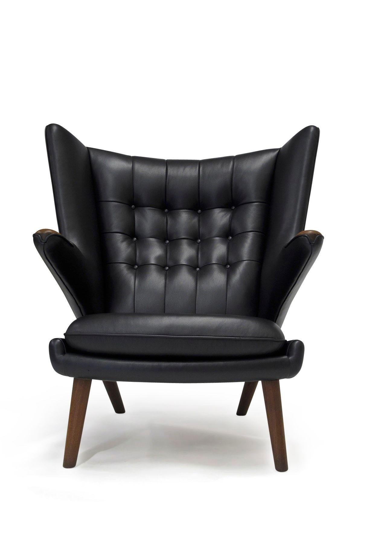 Hans J. Wegner for Anker Pedersen model AP19 Papa bear lounge chair and ottoman, 1953, Denmark. Perfectly restored to the exact specifications of the original upholstery, in Swedish Elmo black leather over horsehair and cotton