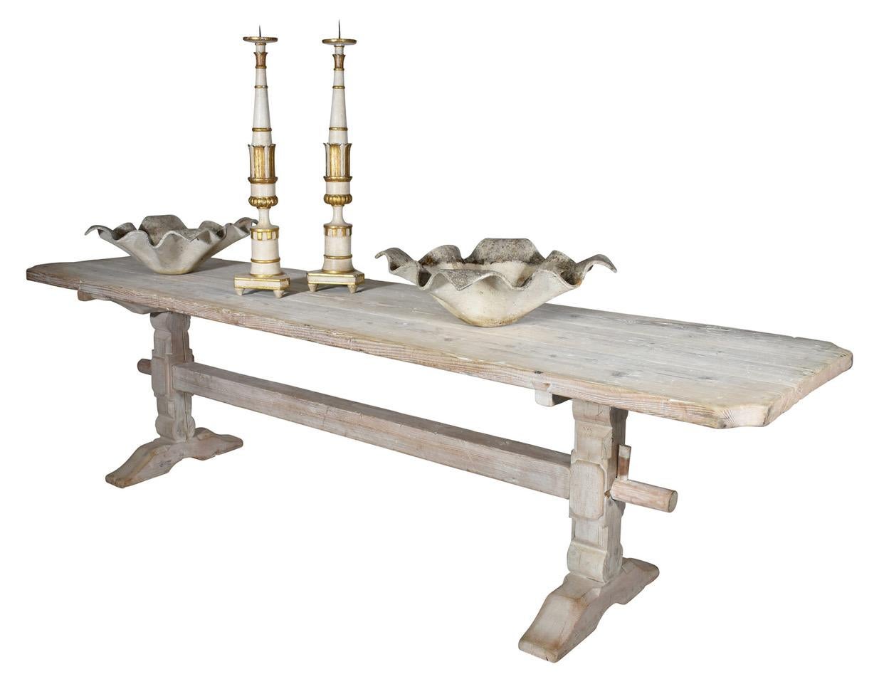 Farm table made in Italy with substantial plank top and stretcher has a weathered white patina. New wood pegs married with old wood and vintage Italian craftsmanship makes this a lovely dining table.
  
