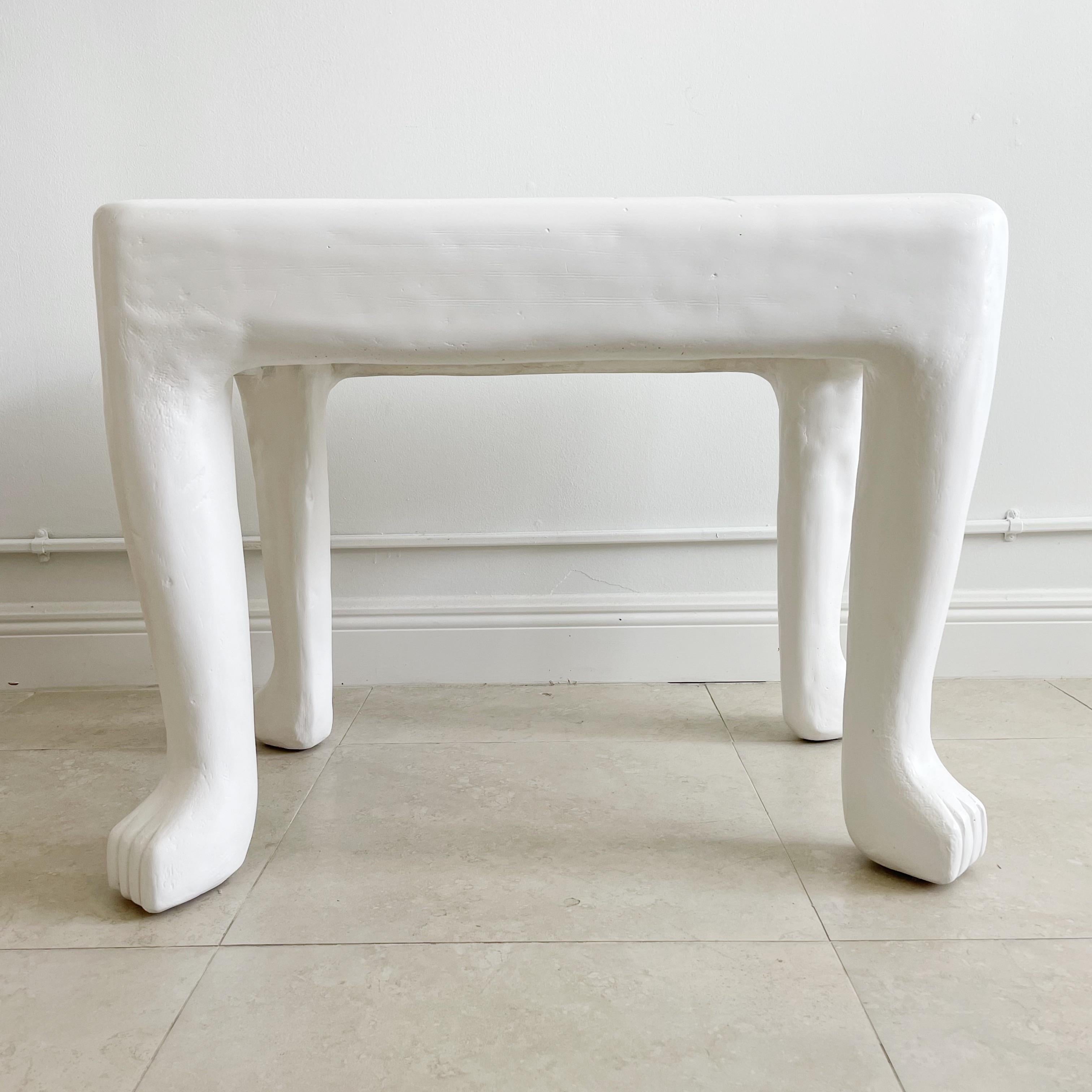 From the imagination of John Dickinson (1919-1982), we offer this authentic, iconic occasional table fashioned of cast plaster over rebar. The primitive animal paw-legged piece is a superb example of Dickinson's work, and a masterpiece of mid