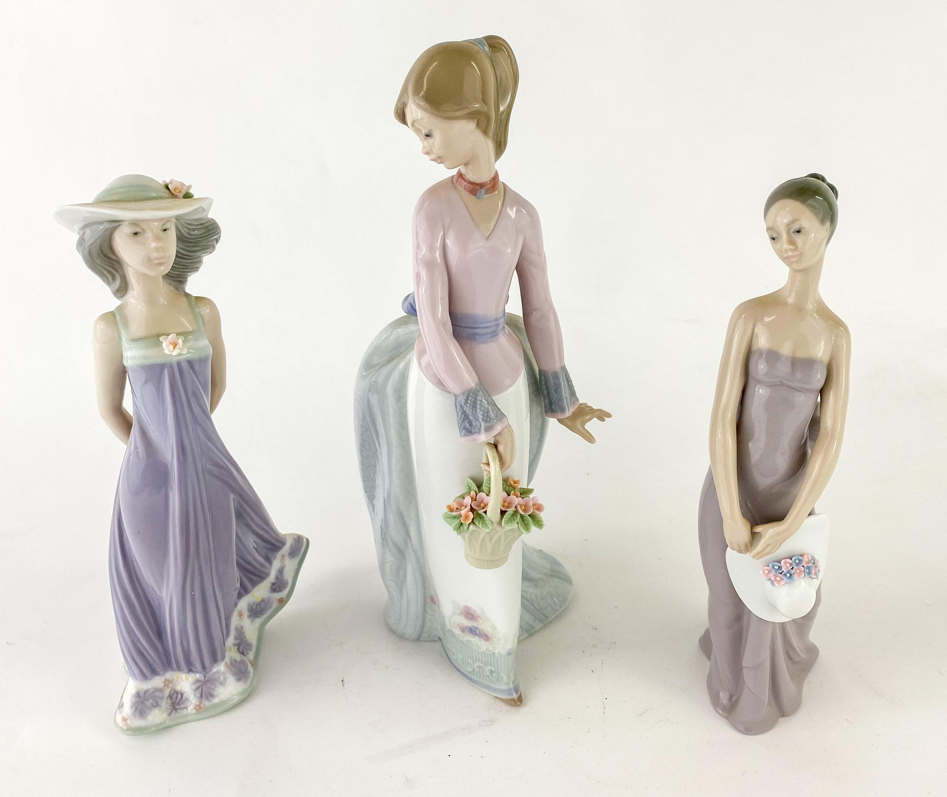 A beautiful Authentic set of 3 retired ladies figurines handmade in Spain by LLadro. The set includes: 
 Figurine 1 entitled 