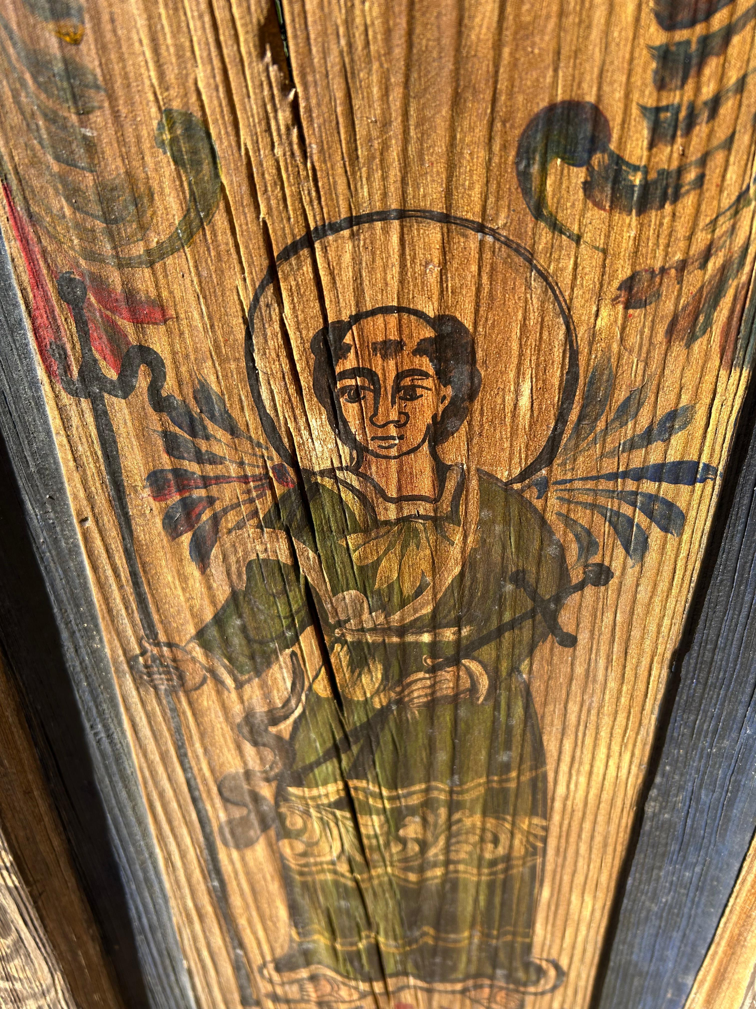 Wonderful folk art primitive painting of a saint on distressed wooden panel.