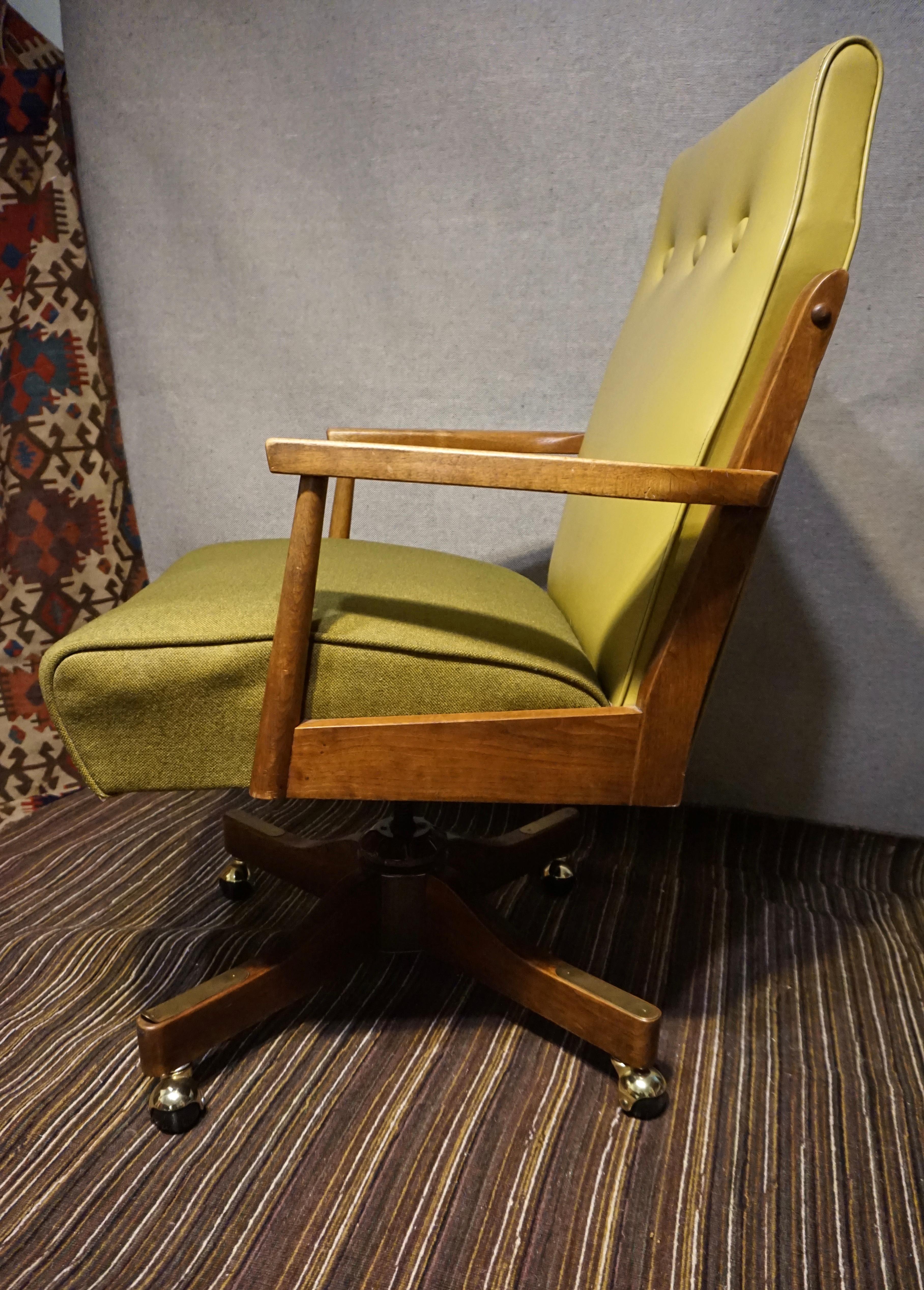 Circa 1960's

Teak revolving office armchair on detachable casters from the mid century. Original Vinyl backrest and fleck wool upholstery in excellent original condition save for single fray at base. Mechanism sound. Nice depth for extended thigh