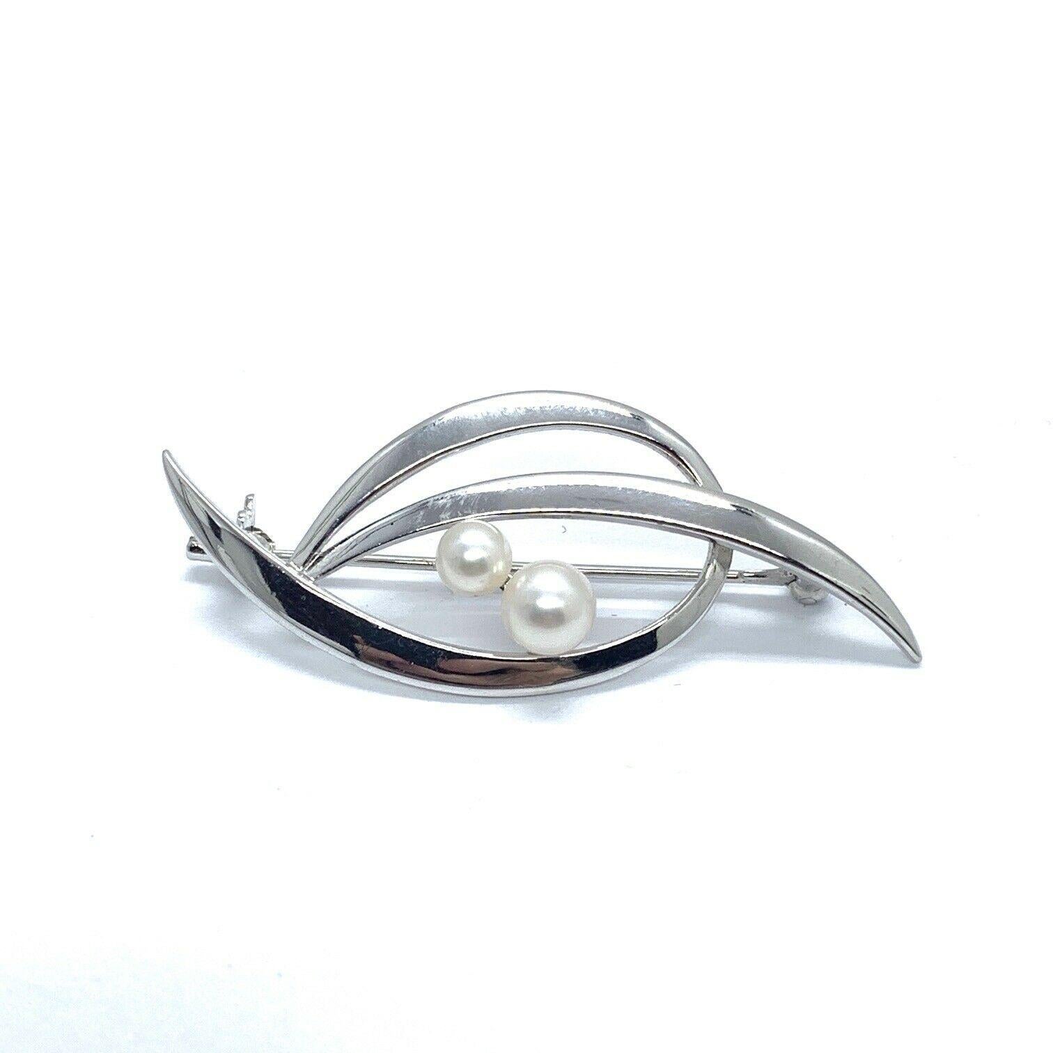 silver and pearl brooch