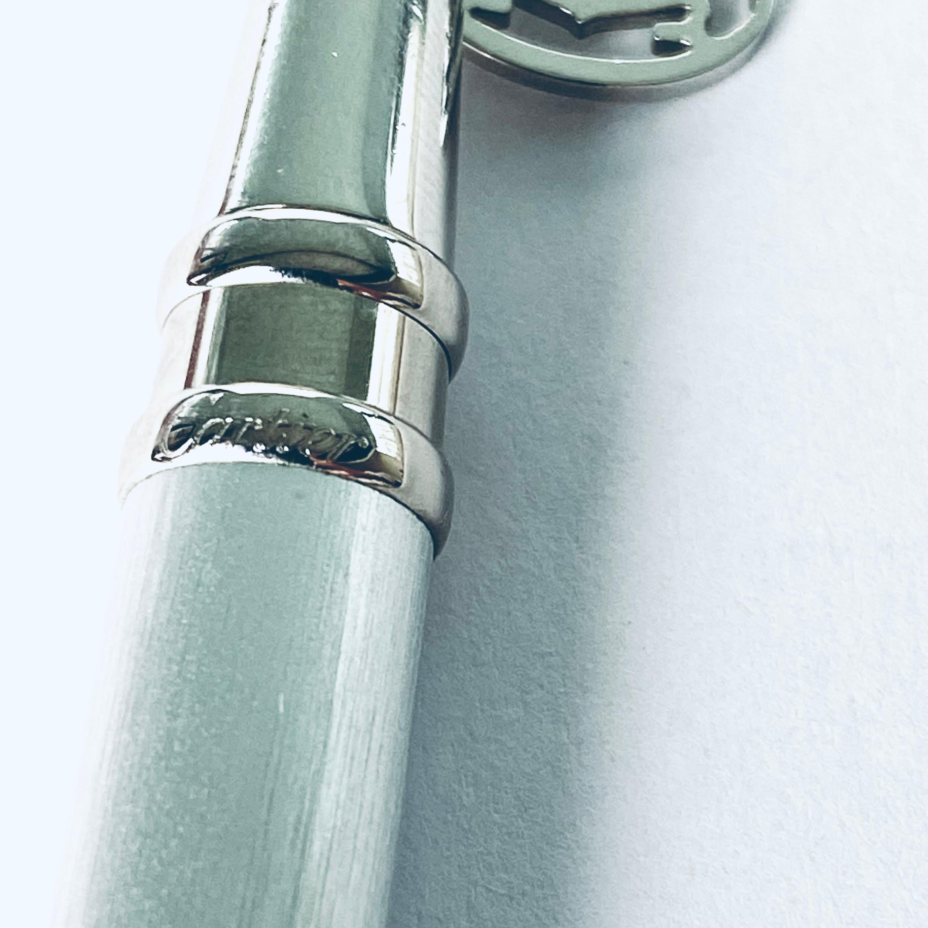 Authentic Must de Cartier Ballpoint Pen with Cartier Charm - A100783
Description:
Elevate your writing experience with the timeless elegance of the Must de Cartier Ballpoint Pen, adorned with a distinctive Cartier charm marked A100783. This