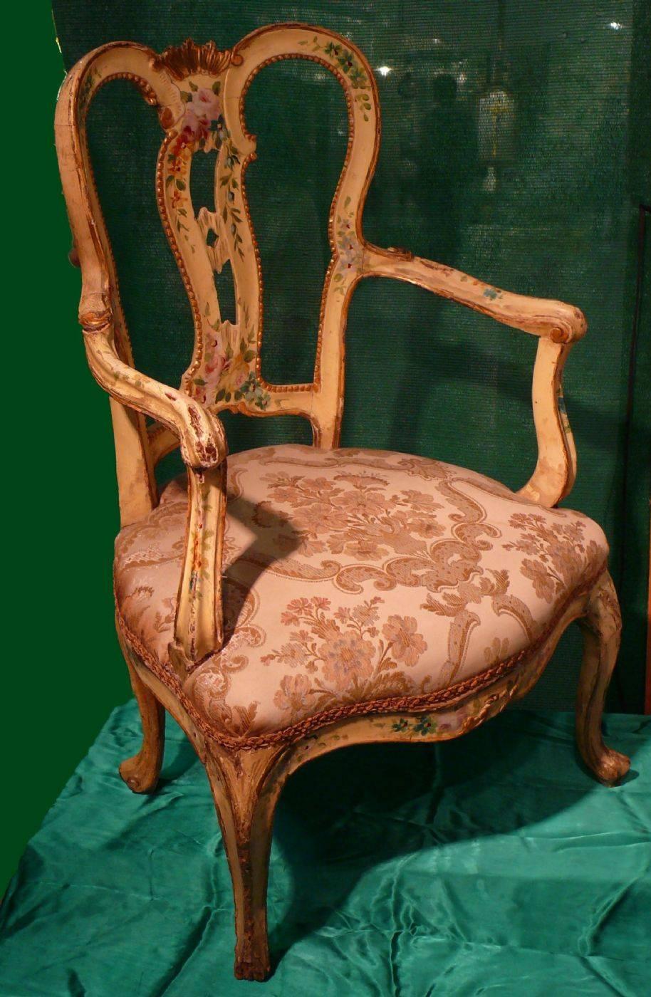Authentic pair of lacquered armchairs, decorated in a bunch, from the first half of the eighteenth century, Venice. Exceptional furniture. Status: never restored. They are part of a whole including also: a bench, two chairs, a sofa, a console.