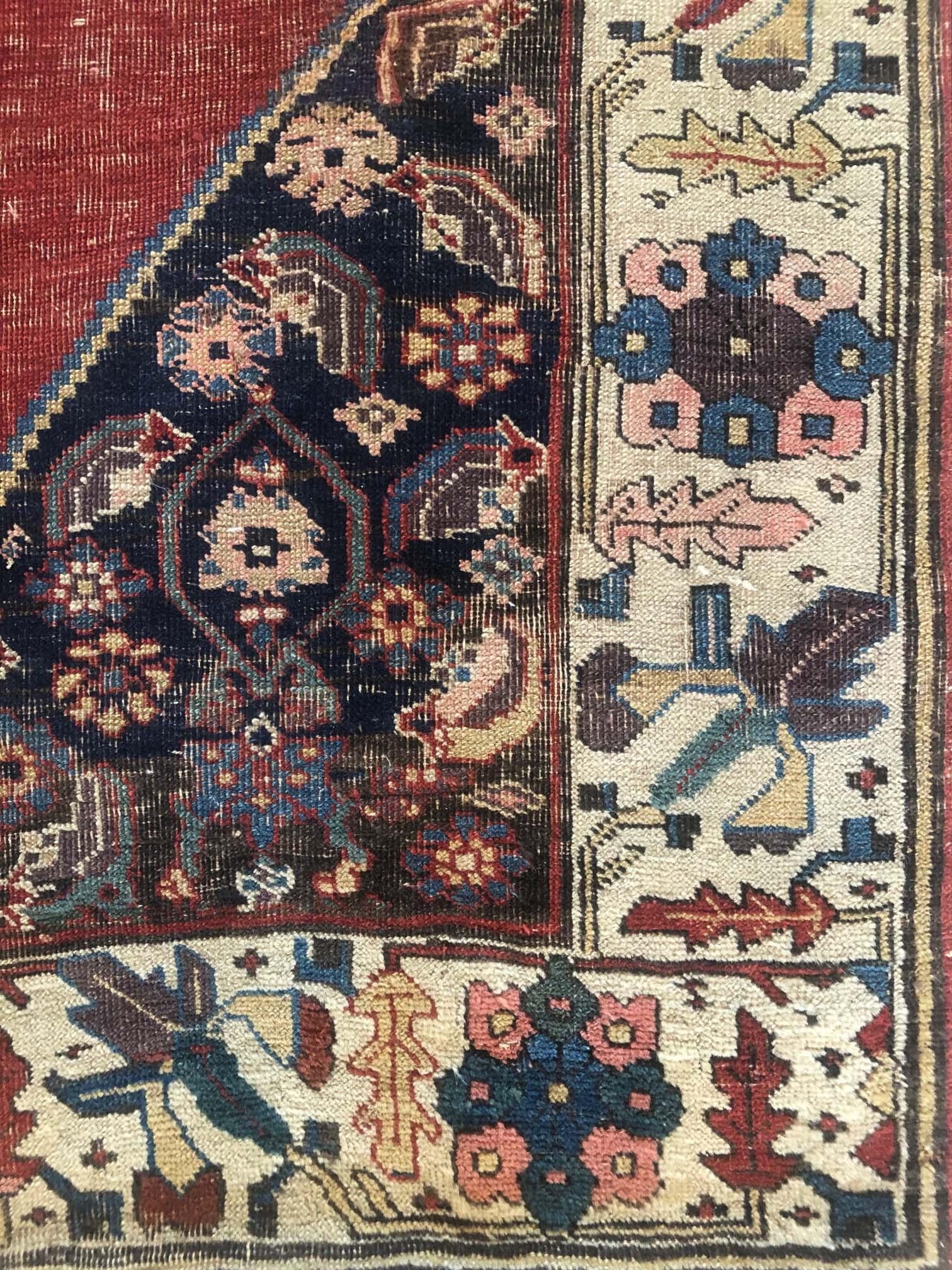 This antique rug is from Bijar which is a market center in Northwestern Iran, about 150 miles south of Tabriz. This is a very unique piece circa 1880s. The pile and foundation are wool. The design is open field medallion and the base color is salmon