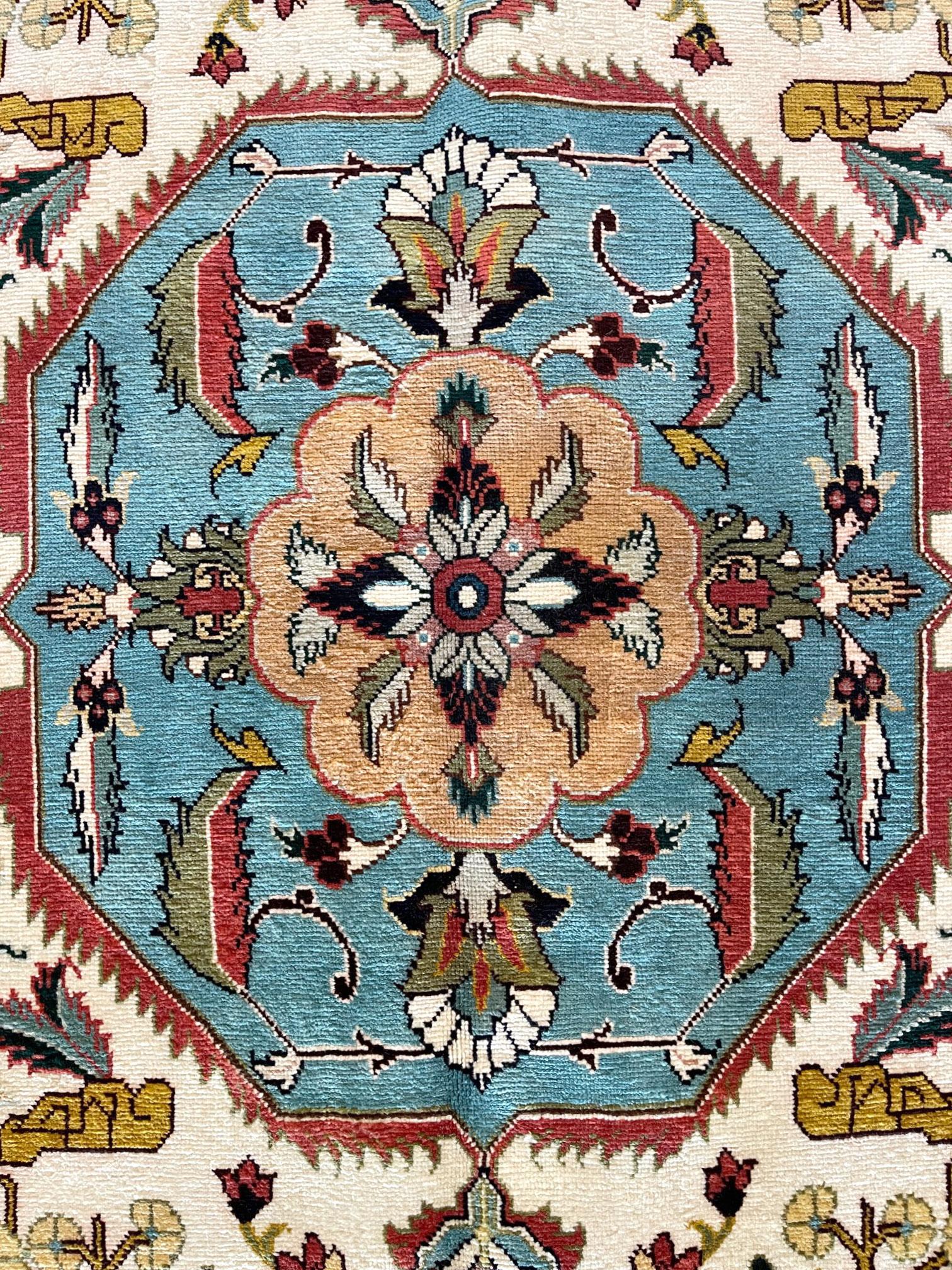 This Persian Tabriz-Heriz rug has wool pile and cotton foundation. This rug has an unsual geometric design with octagonal medallion which can complements modern furnishings and the artistic design enhances the interior of the room. The base color is