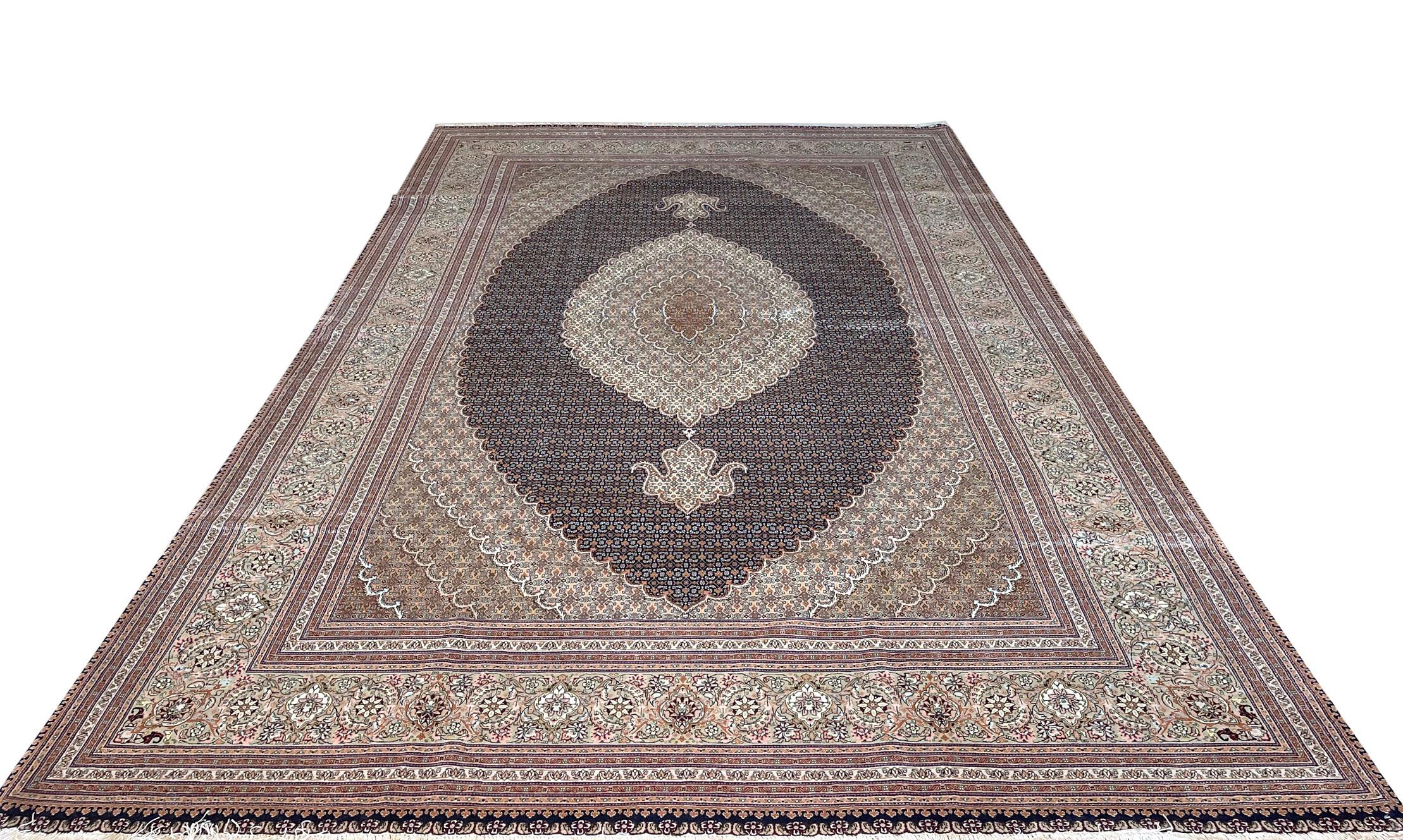 Tabriz rugs are well known for their excellent weaving and design. One of the very famous patterns of Tabriz rugs are Fish Design known is Mahi. This beautiful piece has wool and silk pile with silk foundation. 
This is a very rare piece because