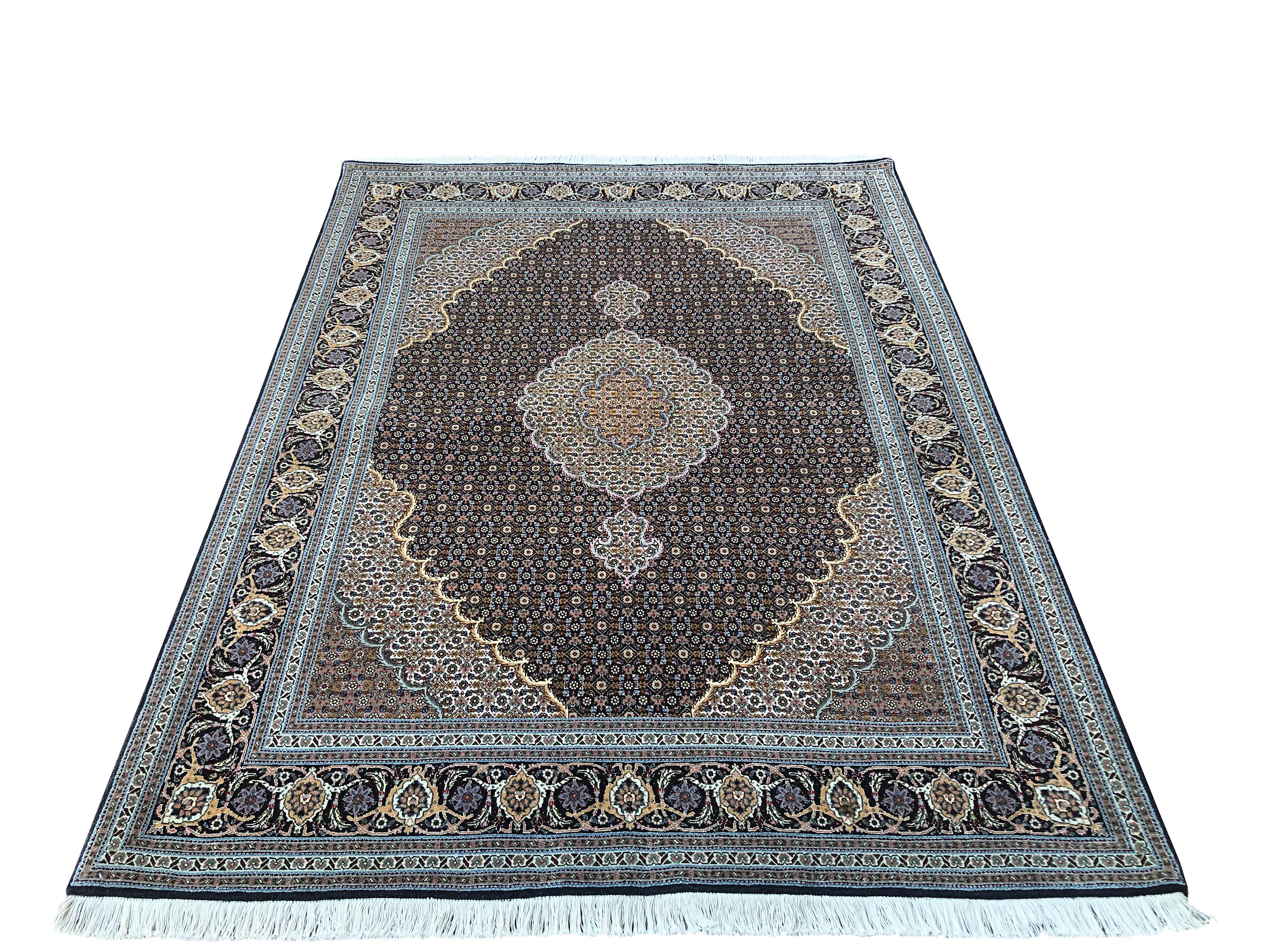 Tabriz rugs are well known for their excellent weaving and design. One of the very famous patterns of Tabriz rugs are fish design known is Mahi. This beautiful piece has wool and silk pile with cotton foundation. This is an 2000s fine 50 “RAJ”