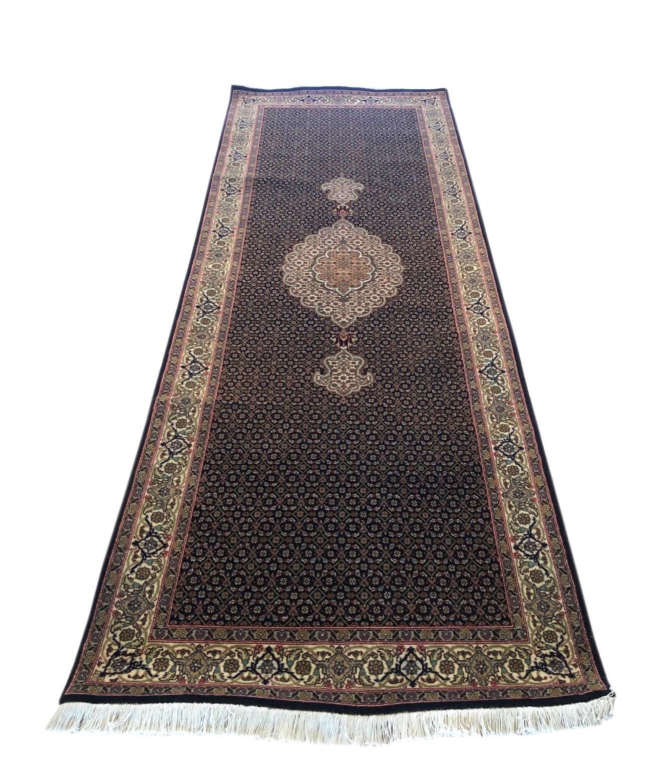 Tabriz rugs are well known for their excellent weaving and design. One of the very famous patterns of Tabriz rugs are Fish design known is Mahi and is one of the classis patterns produced by the masterful carpet in Tabriz. This beautiful piece has