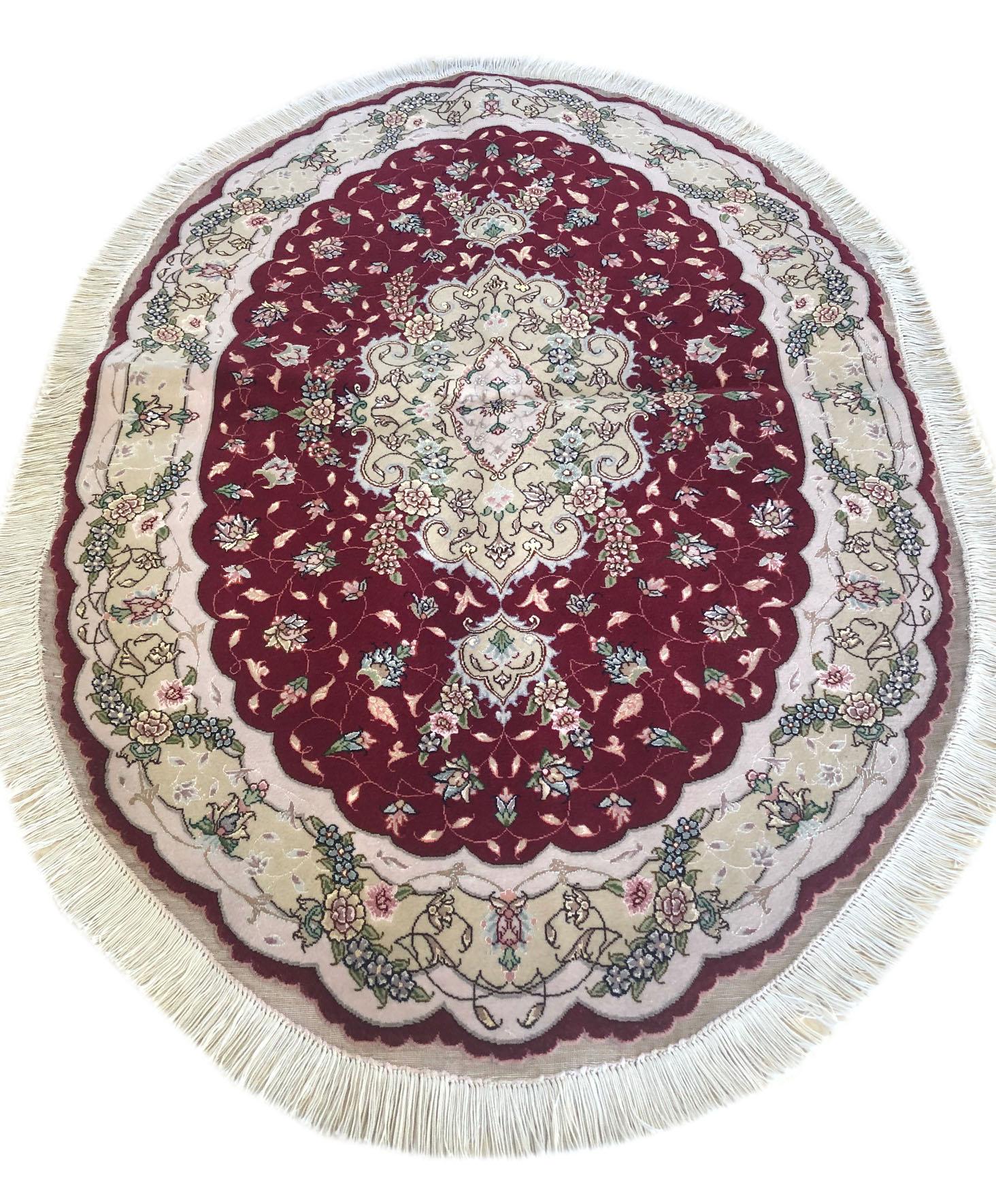 This authentic Persian handmade runner has wool and silk pile with cotton foundation. This beautiful rug is from Tabriz and the design is medallion, floral. The base color is cream and the border is cream. The size is 3 feet 3 inch by 4 feet 9 inch.