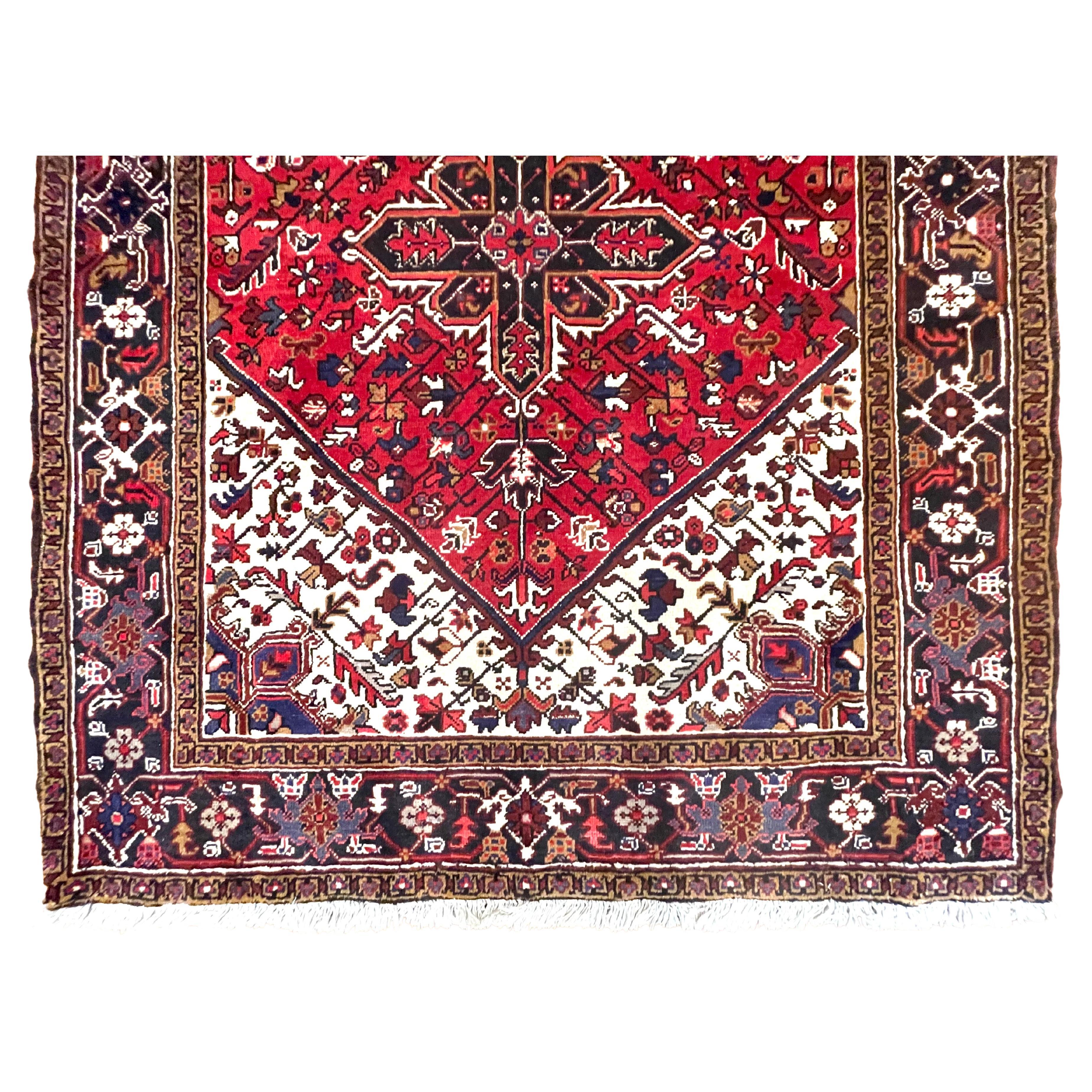Introducing Persian Heriz rug, Heriz rugs are Persian rugs from the area of Heriz, East Azerbaijan in northwest Iran, northeast of Tabriz. This rug has wool pile and cotton foundation, hand knotted with a very good condition for its age. This rug