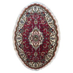 Tapis de Tabriz ovale rouge persan