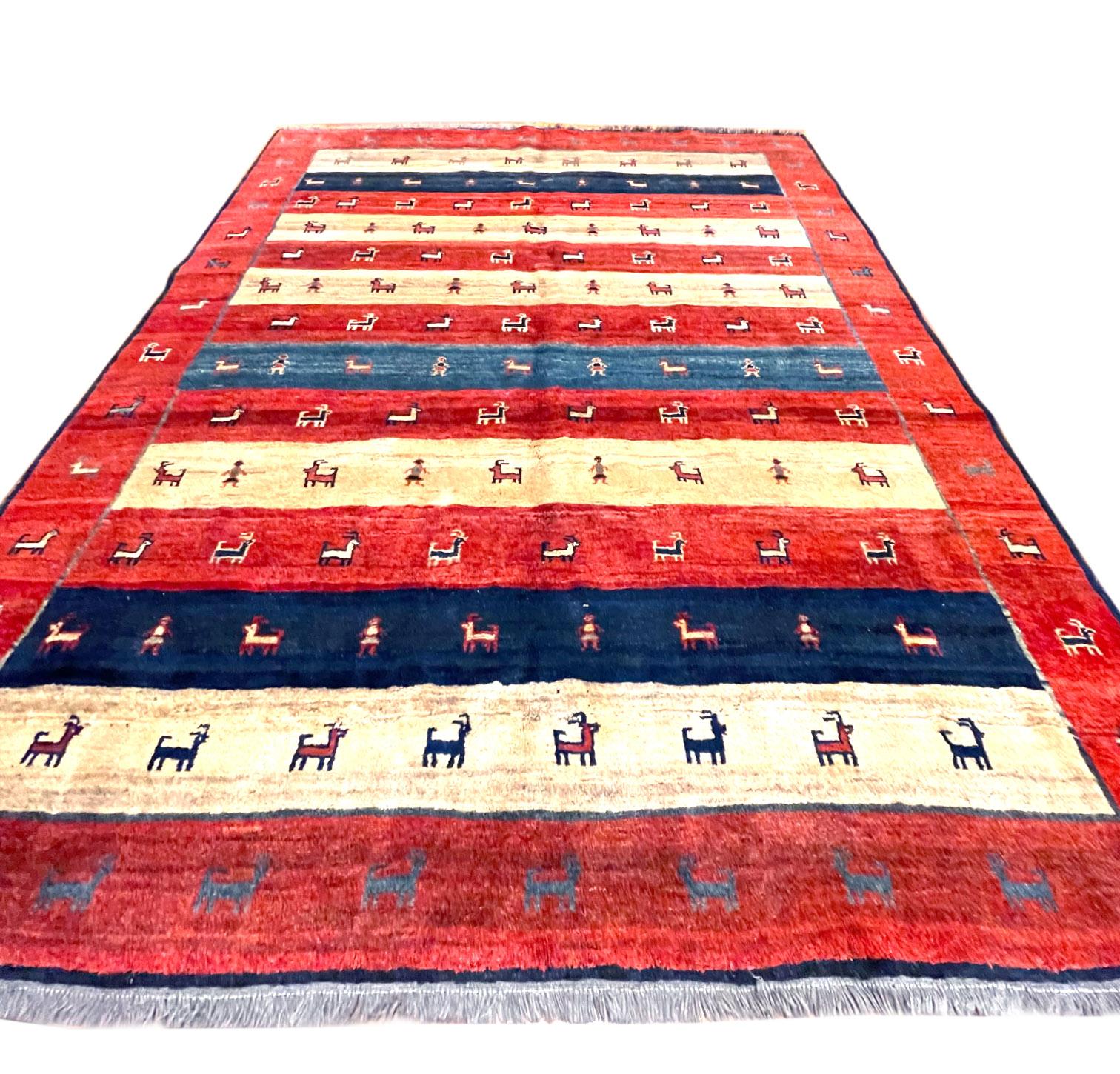 This stunning piece is a hand-knotted Persian Gabbeh rug. Gabbeh rugs are a variety of Persian hand knotted carpets which mostly are made by nomadic Qashqai tribes in southern Iran (Shiraz). This unique piece has created from high quality hand spun