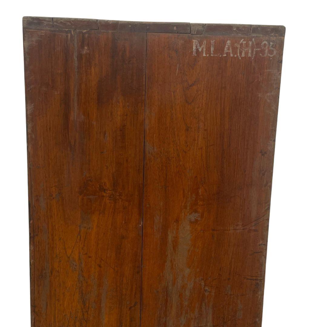 A double-sided low cupboard known as the “File Rack” (model PJ-R-27-A), handcrafted in solid teak with its original M.L.A. (H)-95 marking. Designed in the late 1950s for the administrative buildings of Chandigarh, India, this piece embodies Pierre