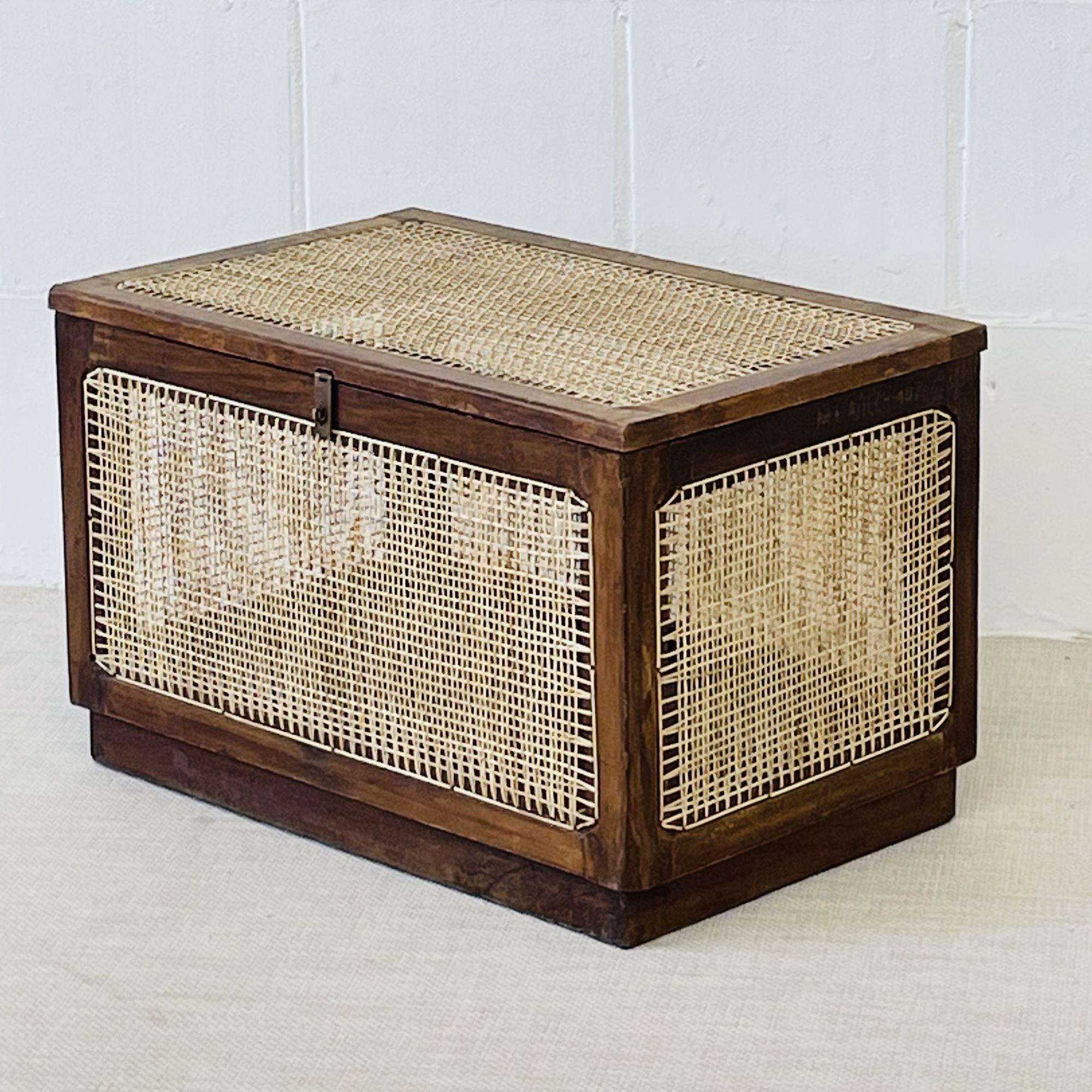 Pierre Jeanneret 'Dirty Linen Basket' 
 
Provenance: M.L.A. Flats building, Chandigarh, India
 
France, India, c. 1960s
Teak, Cane, Brass
 
Each with markings indicating provenance - These are directly from Chandigarh, India. This box has been