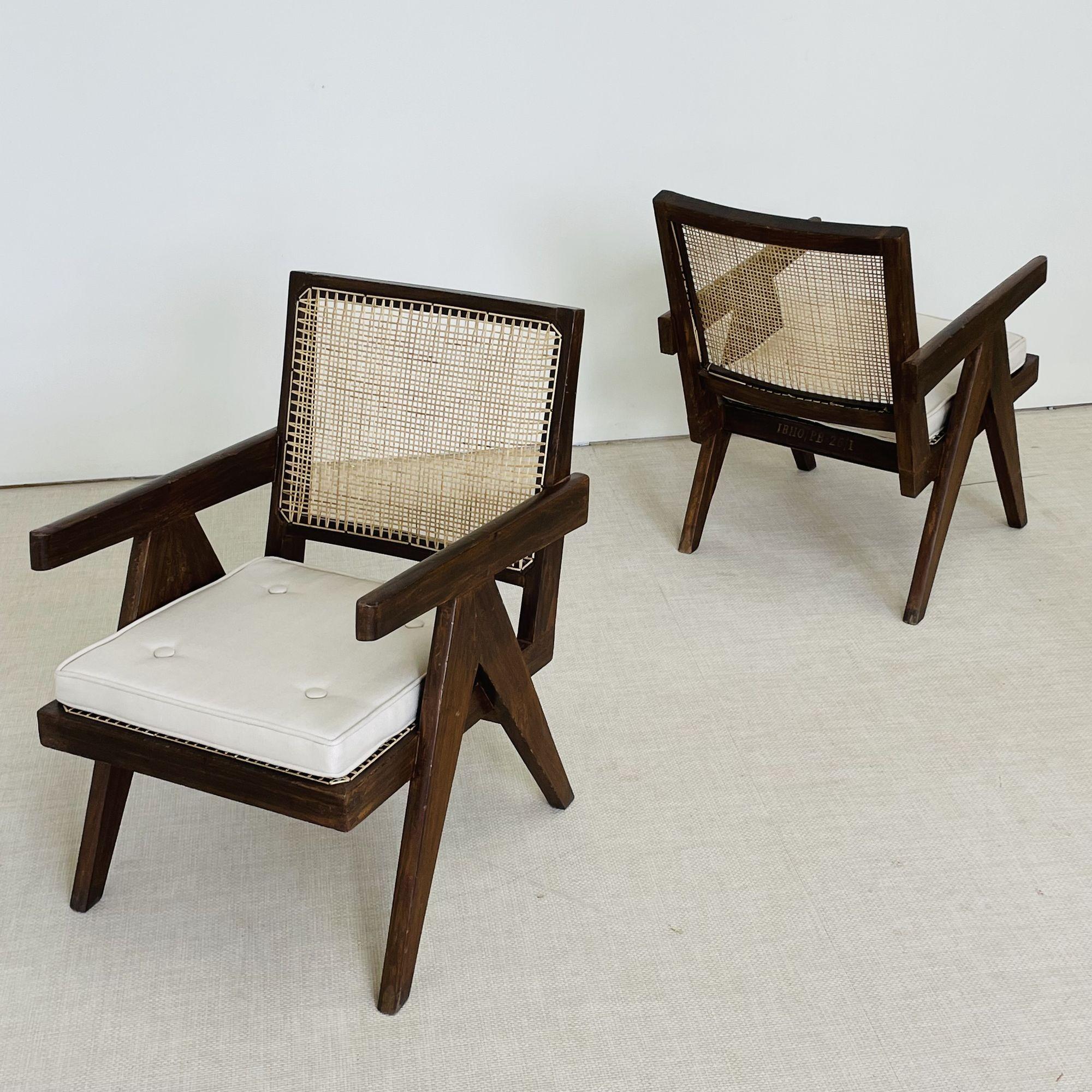 Pierre Jeanneret, French Mid-Century Modern, Lounge Chairs, Cane, Chandigarh

Pierre Jeanneret 'Low Easy' Armchairs, Model PJ-SI-29-A. Iconic pair of teak and cane lounge chairs have a compass-type double side leg assembly and a slanted, slightly
