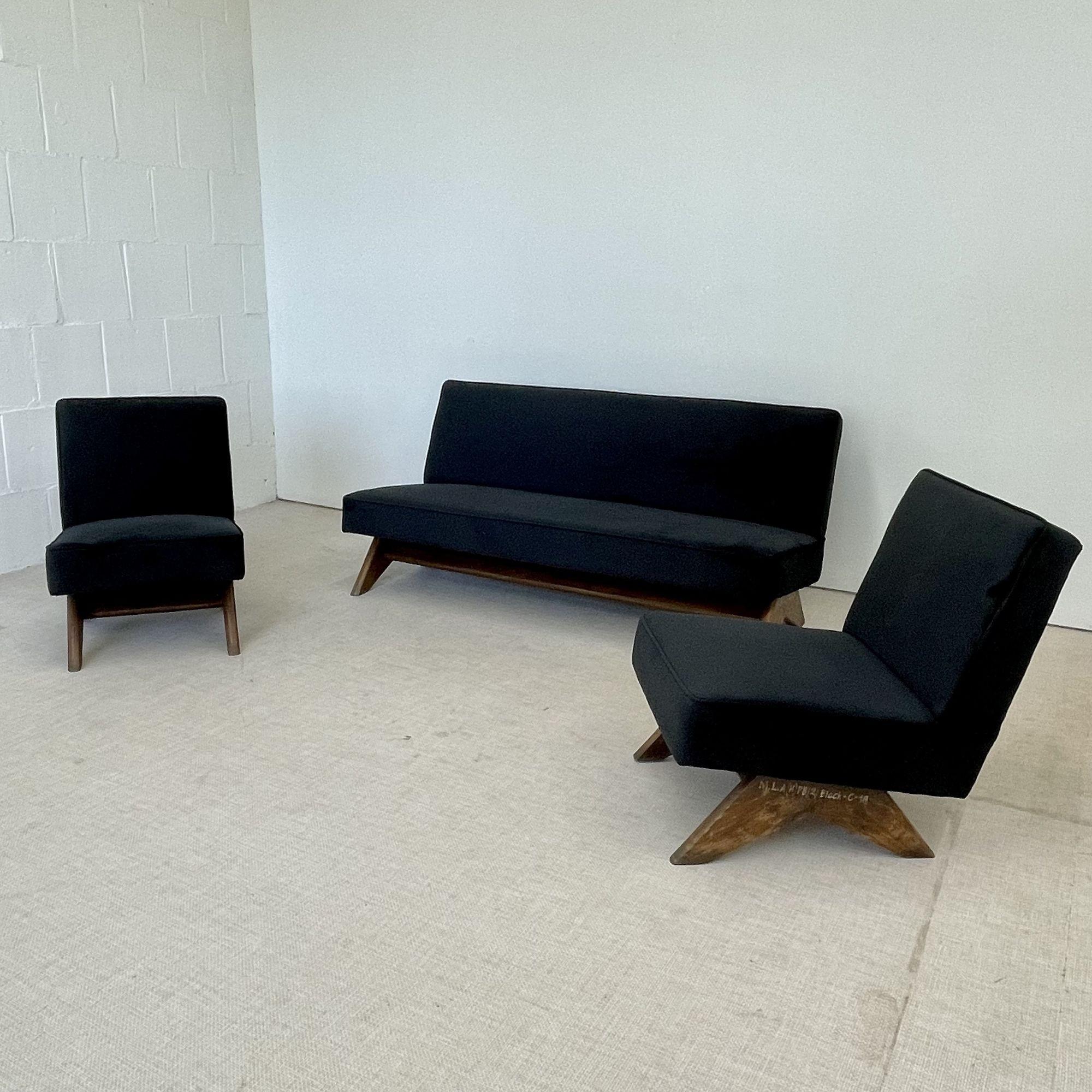 Pierre Jeanneret Upholstered Sofa Set, 'Fireside' Chairs and Sofa, Model PJ-SI-36-A/B
 
Lounge or slipper sofa set featuring a slightly tilted backrest and seat on top of a low compass type leg assembly.
 
Measures: Seat height: 14.50 in.
Chairs: