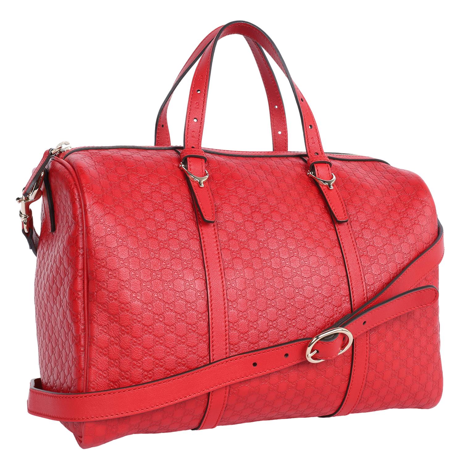 Authentic, pre-loved Gucci GG Guccissima Medium Joy Signature Bag in Red. This stylish bag features Gucci monogram embossed Guccissima leather in red. The bag features rolled leather top handles, an optional shoulder strap, gold hardware, zipper top