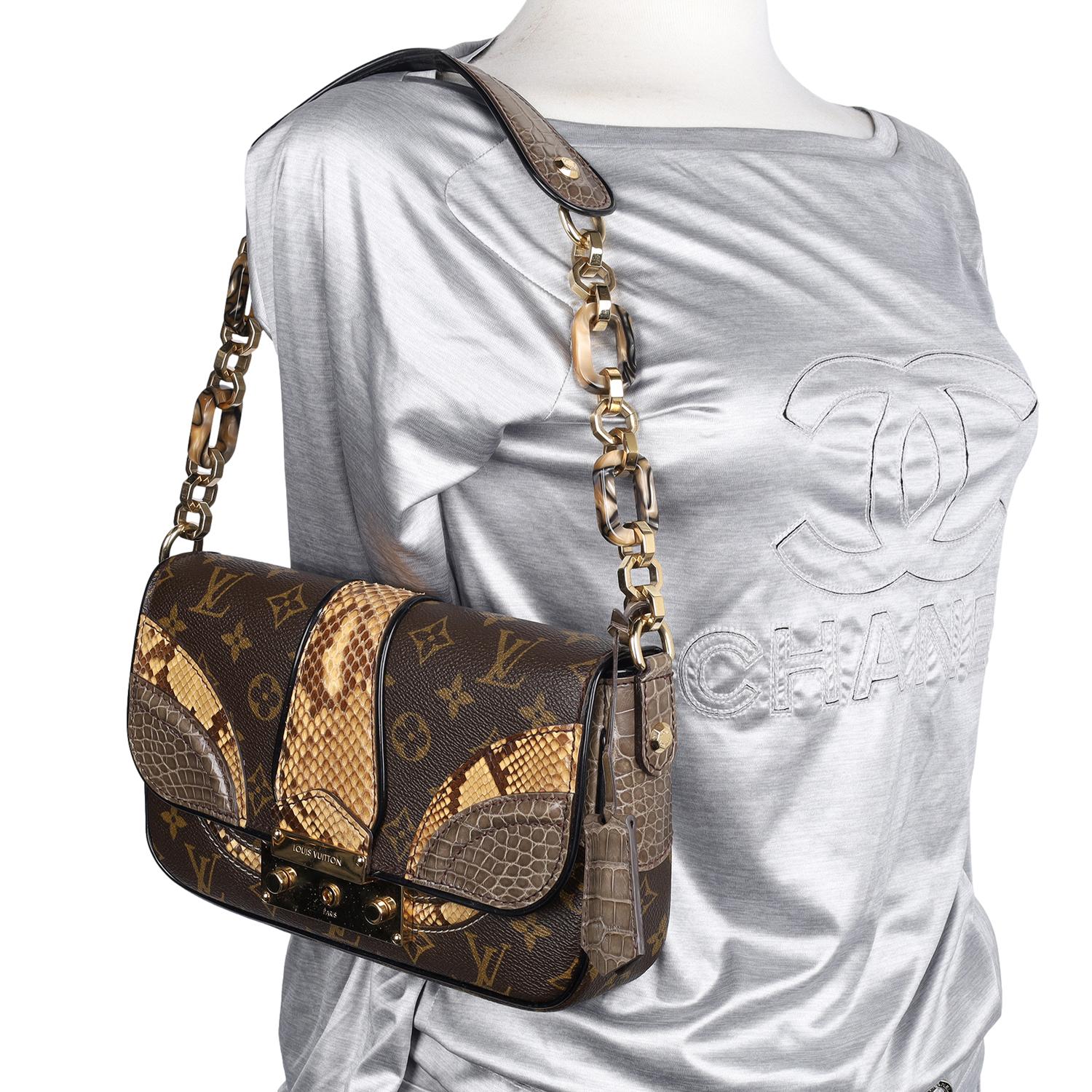 Authentic limited edition Louis Vuitton Brown Monogramissime Alligator and Python Bag.

Featured in the Fall/Winter 2010 collection, this Pochette bag from Louis Vuitton is a limited edition, constructed with the brand's signature monogram canvas