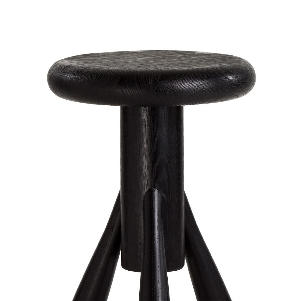Authentic rocket bar stool in oak with black lacquer by Eero Aarino & Artek. Crafted in solid oak and originally created for Finnish designer Eero Aarnio’s home kitchen, the bar stool has proved very popular since its introduction by Artek. Aarnio